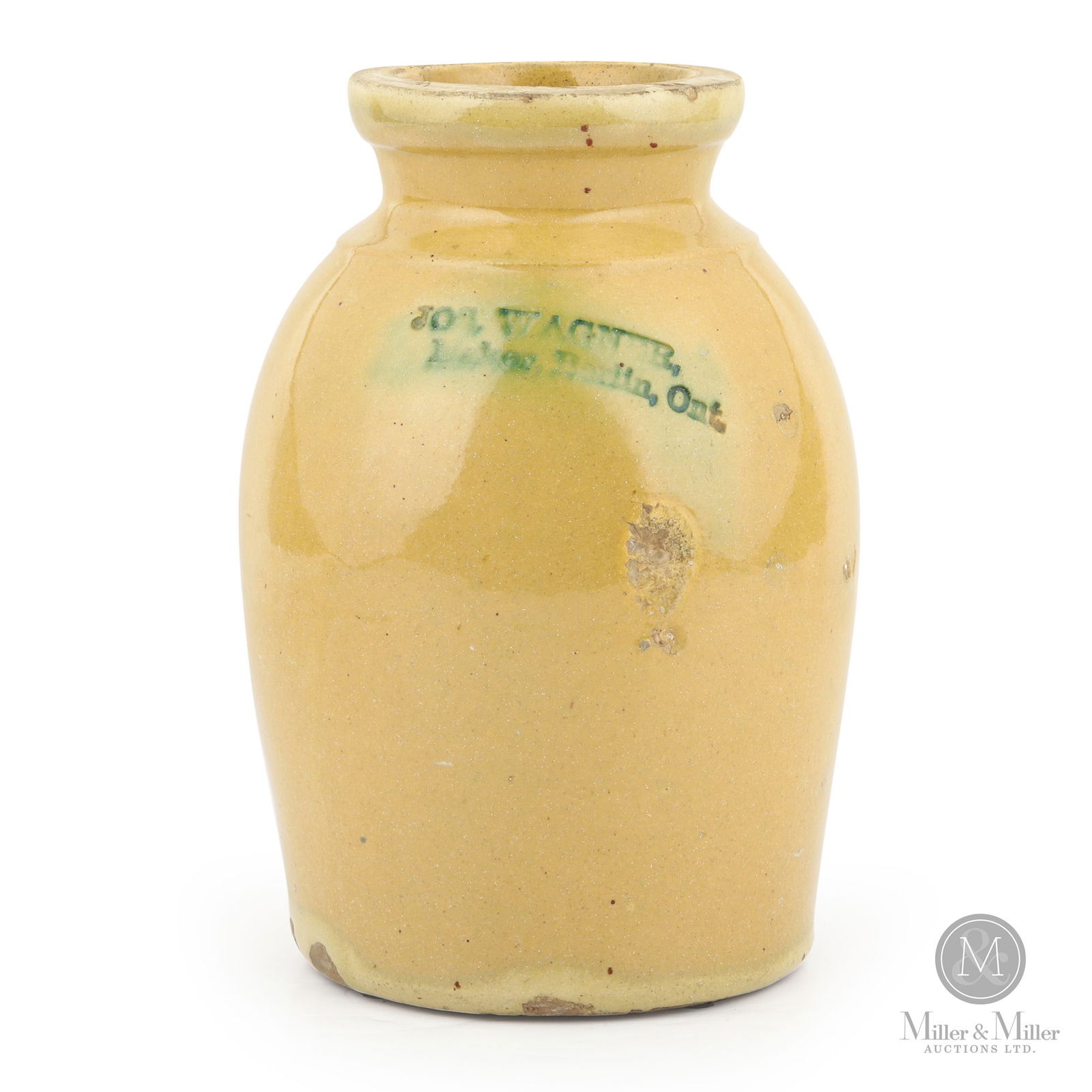 Signed Wagner, Berlin Half-Gallon Earthenware Jar: Berlin, Ontario. 1870s. Earthenware. Rare. A very desirable mark for redware collectors. A strong stamp beautifully accented with copper oxide glaze. Stamped, "Jos. Wagner / Maker, Berlin, Ont.". 8.5"