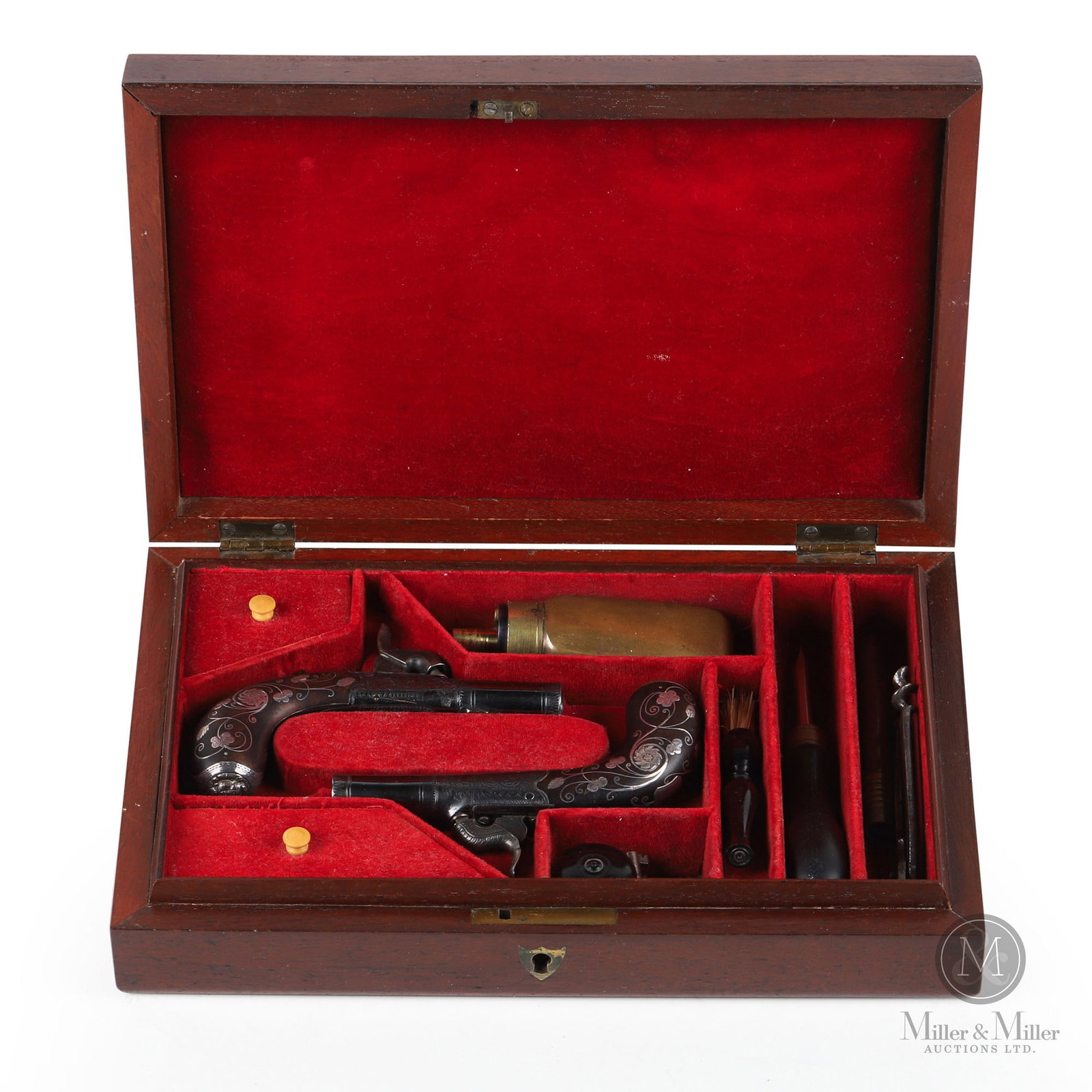Evans Cased Miniature "Muff" Pistols: French. 1840s. Each finely engraved on frame. The wooden handles on both pistols are highly decorated with silver wire inlay as well as inlays of flowers and leaves. The silver butt caps are designed 