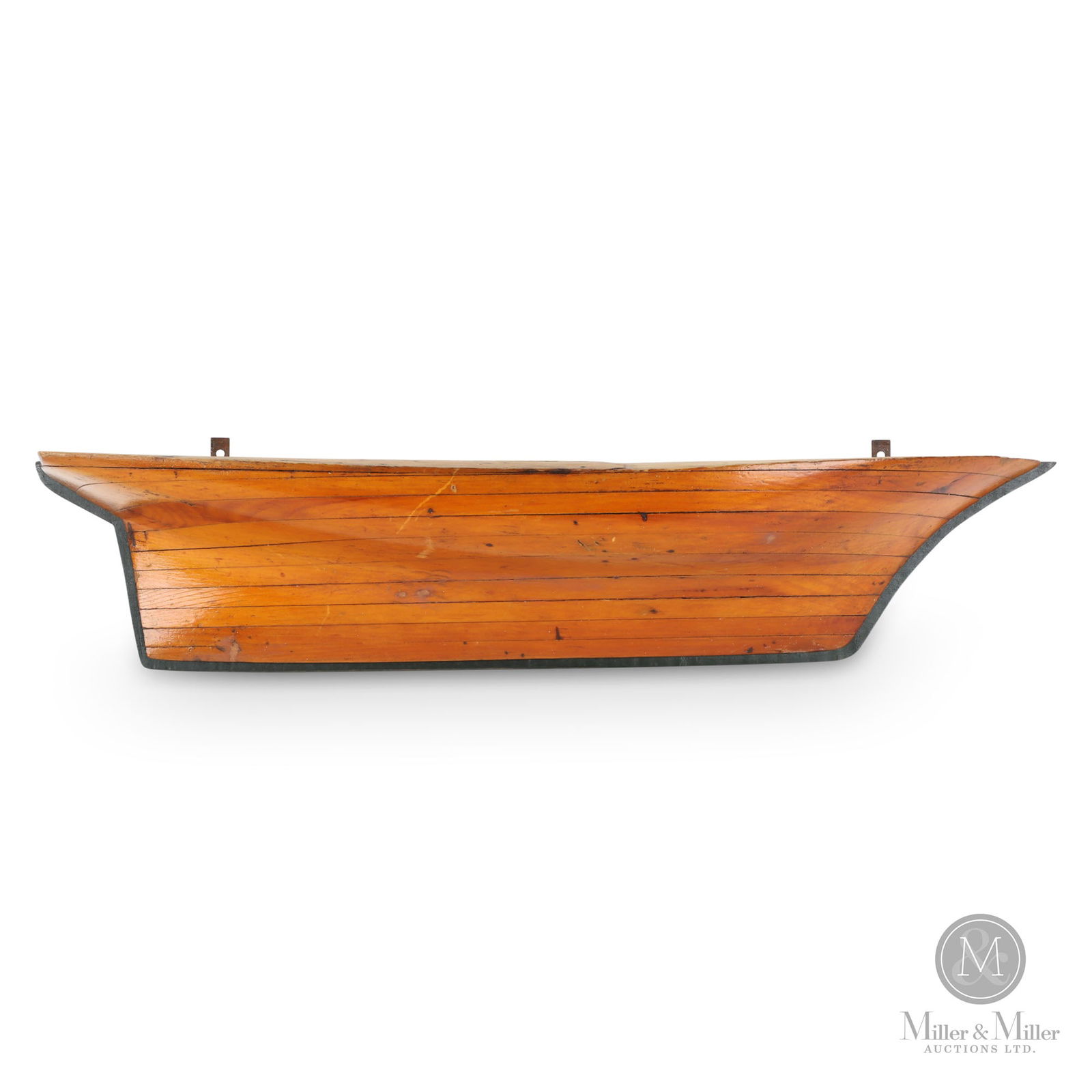 Half-Hull Model: A half-hull ship model in a varnished surface mounted on a black backboard. Good form and colour, minor scrapes and nicks. 19th century. 5.75" x 27" x 5.5".