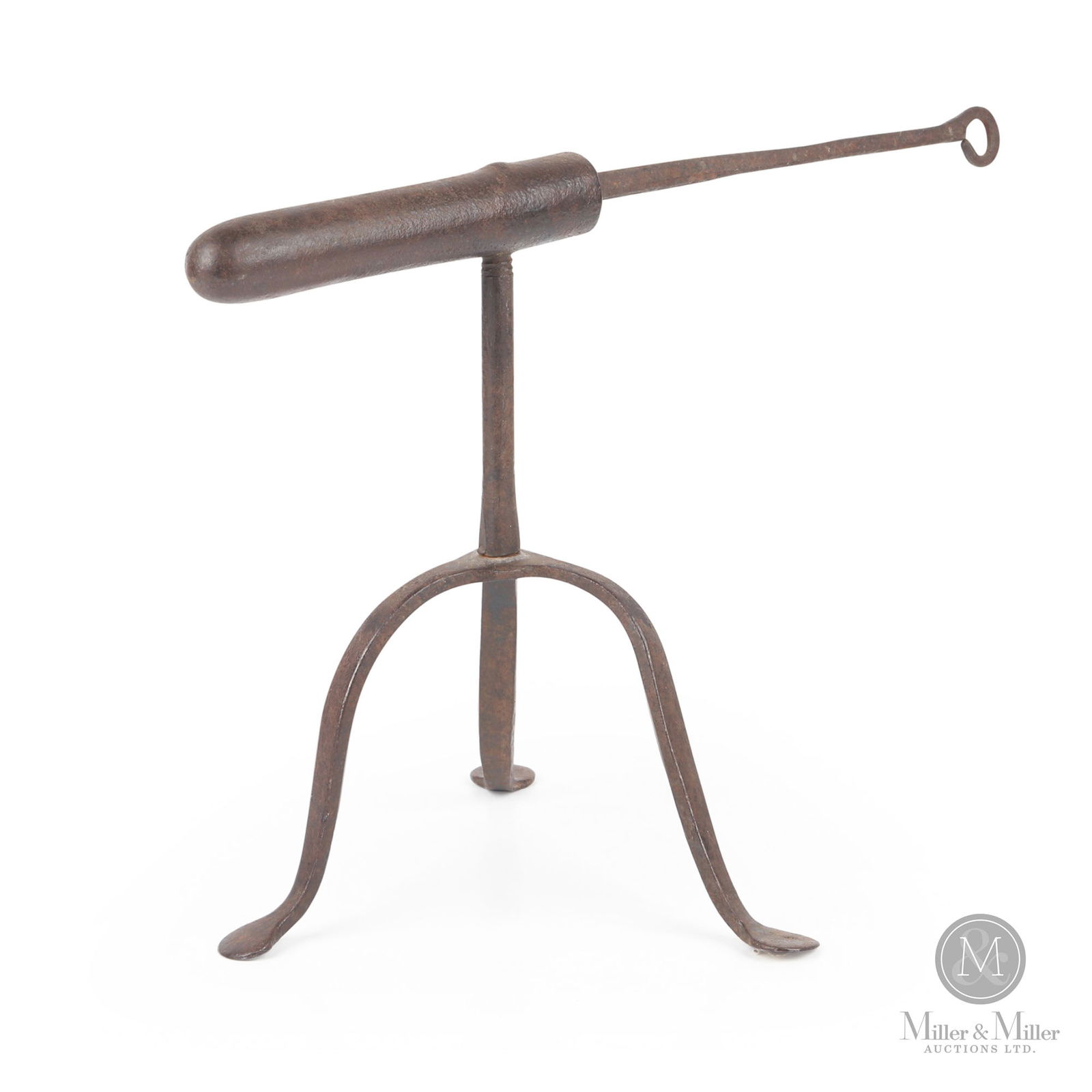 Forged Goffering Iron: A hand-forged goffering iron having a tripod base and penny feet and the original heating rod. Goffering irons were used for creating shirt collar ruffles and curled shapes in clothing. Late 18th/earl