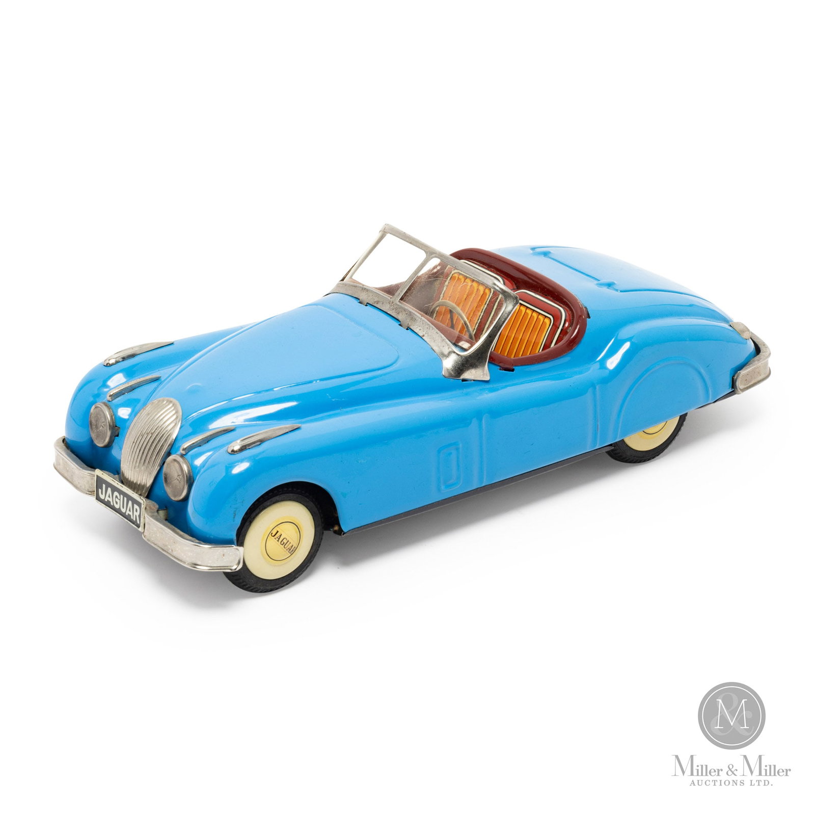 Bandaiya XK Jaguar Roadster: Japanese. 1950s. Bandaiya (now known as Bandai) is considered one of the best Japanese producers of tin toys, often falling into the same category of quality as Mattel and Hasbro. Bandaiya was renamed