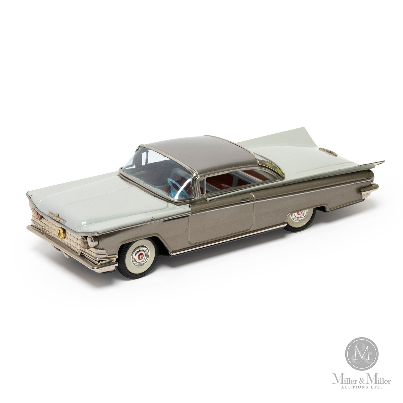 T.N./IY Metal Toys Buick Invicta: Japanese. 1960s. A rare toy, in an unusual colour combination, that seldom comes to market. This toy has 2 maker's names - (T.N.) Toy Nomura and IY Metal Toys. The reason for the two names is that the