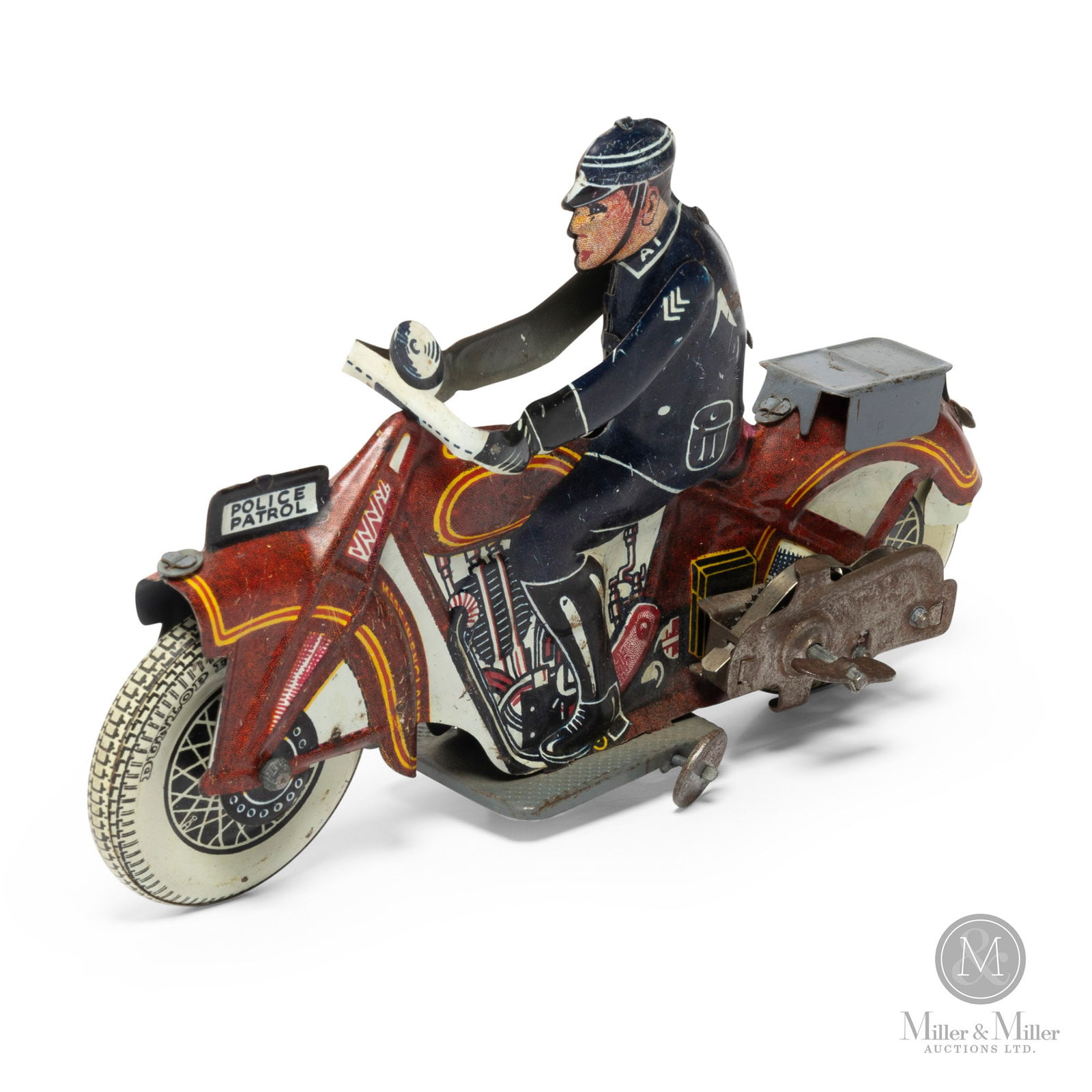 Mettoy, England Police Patrol Motorcycle: English. 1950s. Mettoy (an abbreviation for Metal Toy) is likely most famous for its Corgi toys, which were created in 1956. Their tinplate toys, such as this police patrol motorcycle, remain sought a