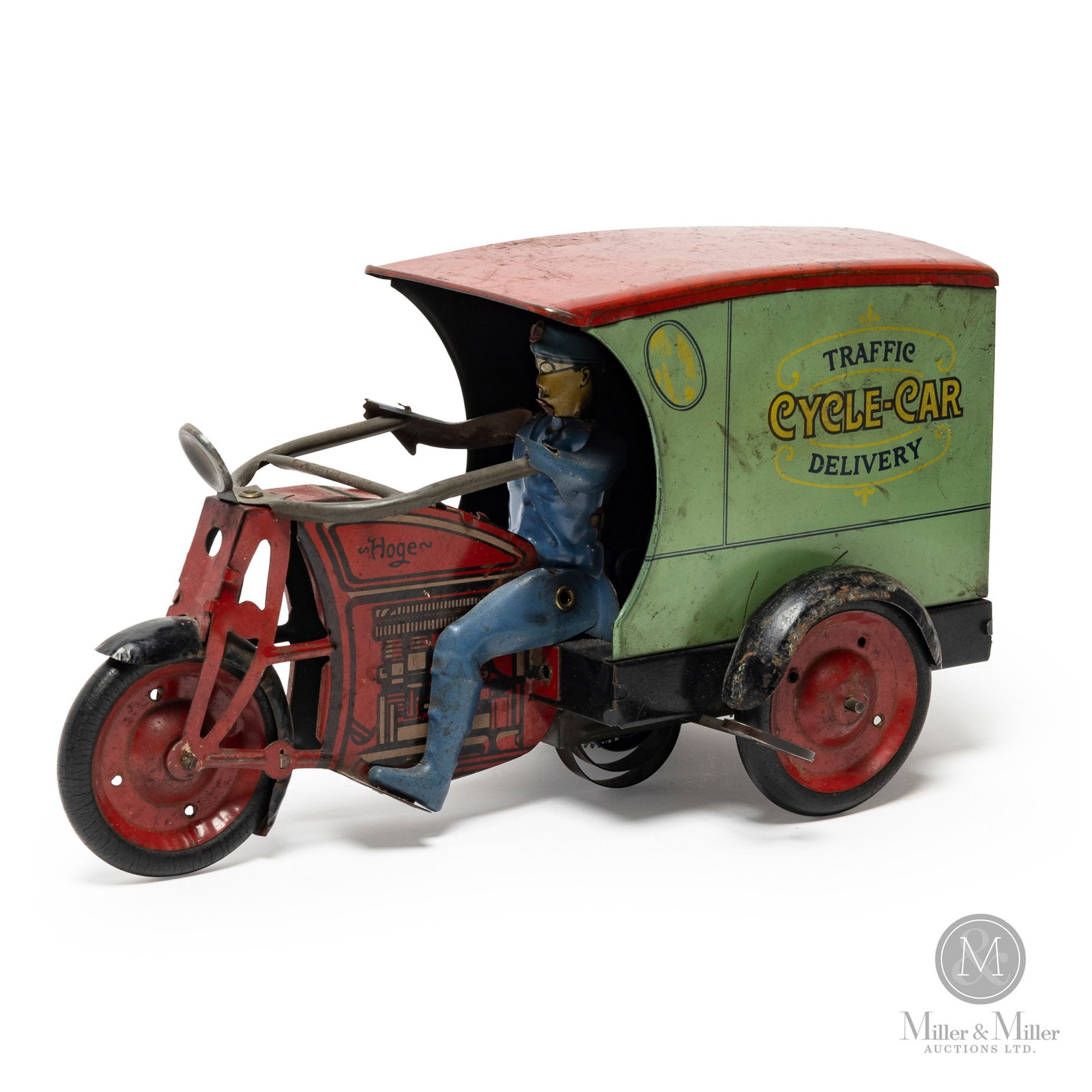 Hoge Cycle-Car Traffic Delivery Motorcycle: American. 1930s. Heavy gauge steel. In an original 1934 paper advertisement, this toy was listed as a mechanical motorcycle with a door in the rear of the body that enables the child to put things in 