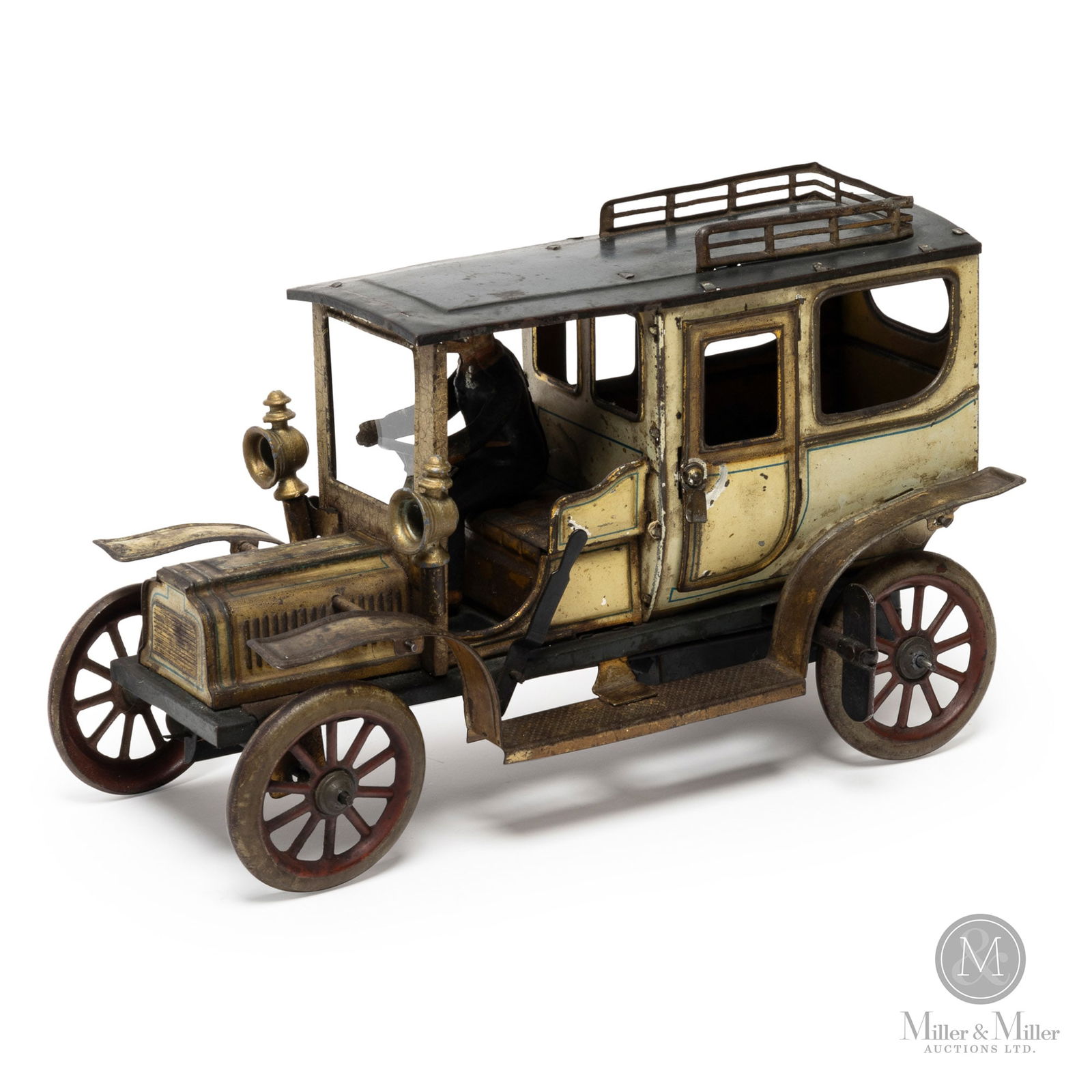 Georges Carette Limousine: German. Early 1900s. Tinplate. Despite the french name, Georges Carette was a German company that produced a large line of superb toys. This Carette limousine was made during a period when cars were o