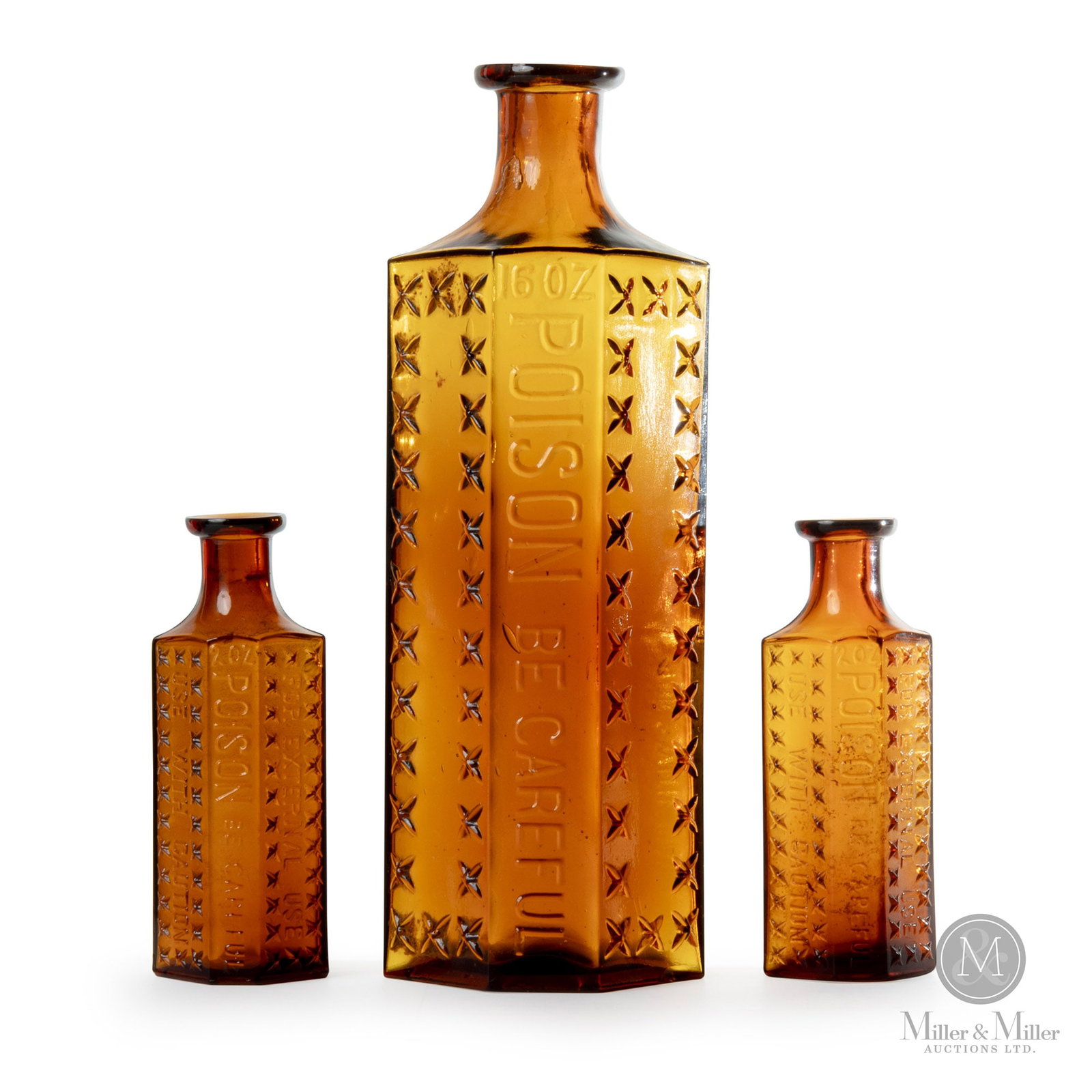 Three Amber Eaton Poison Bottles: Canadian. 1890s. Glass. All amber colour. Very nice lot of rare amber Eaton coffin poison bottles. Marked, "16 oz Poison Be Careful, Toronto", with Eaton mark on bottom. Marked, "2 oz Poison Be Carefu