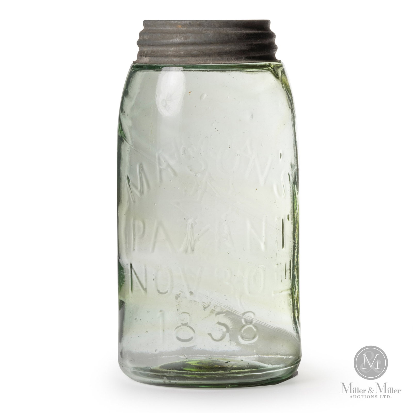 Acme Mason Swirled Quart Fruit Jar: Canadian. Lime-green coloured glass with amber swirls. Zinc band. Made in Nova Scotia. Embossed, on the front and back. 7.25" x 3.75" x 3.75". All items are guaranteed authentic by Miller & Miller Auc