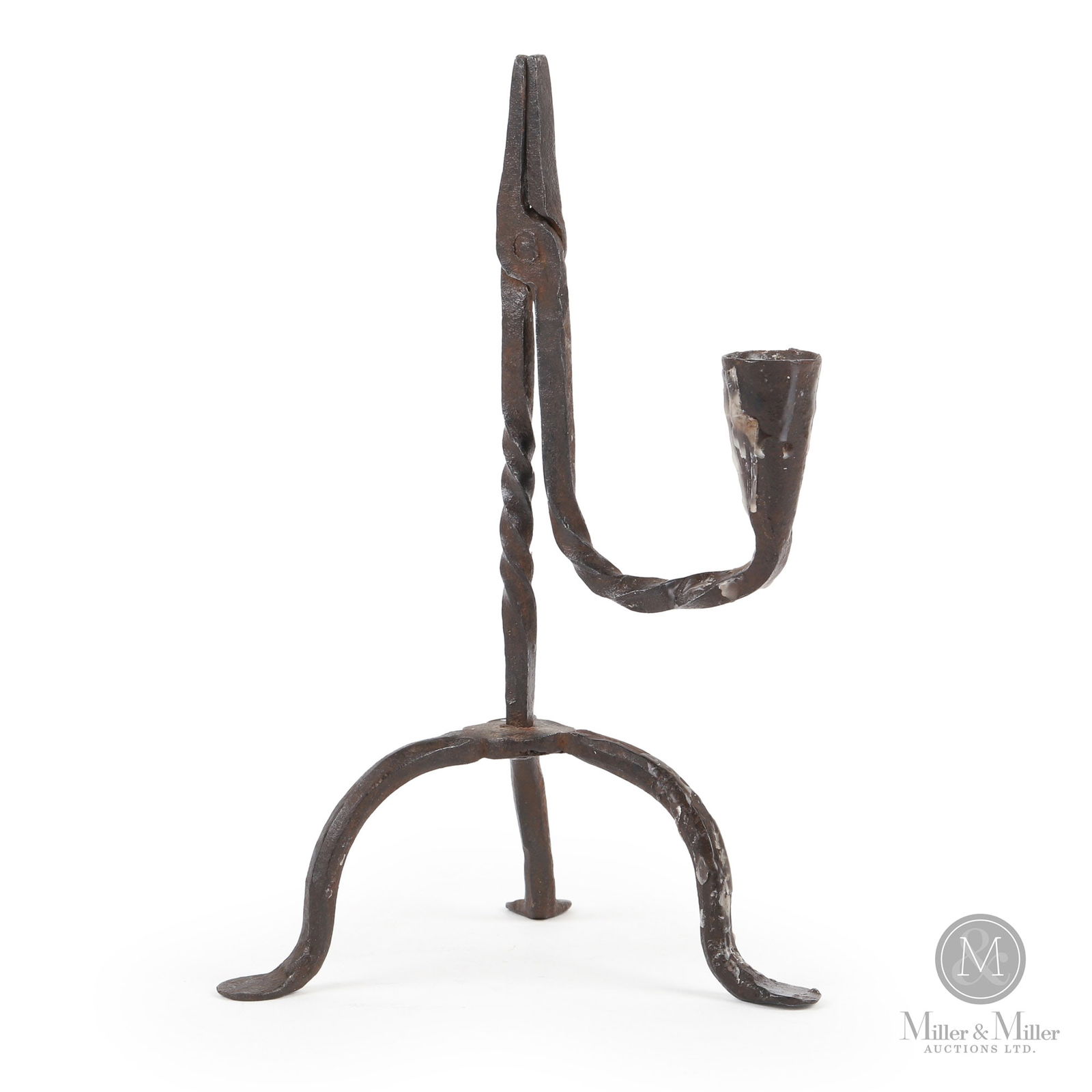 Early Candle/Rushlight: A finely wrought small rushlight on a tripod base with penny feet. 18th century. 9" x 5.5" x 5.5". From the Ray Smith collection.