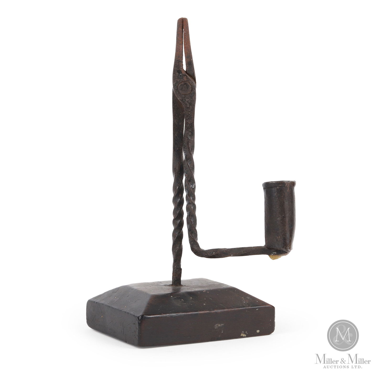 Candle/Rushlight with Original Base: A wrought iron rush light and candle holder with a spiral shaft and arm, mounted on the original beveled hardwood base. Untouched original surface. 18th century. 9.25" x 4" x 4". From the Ray Smith co