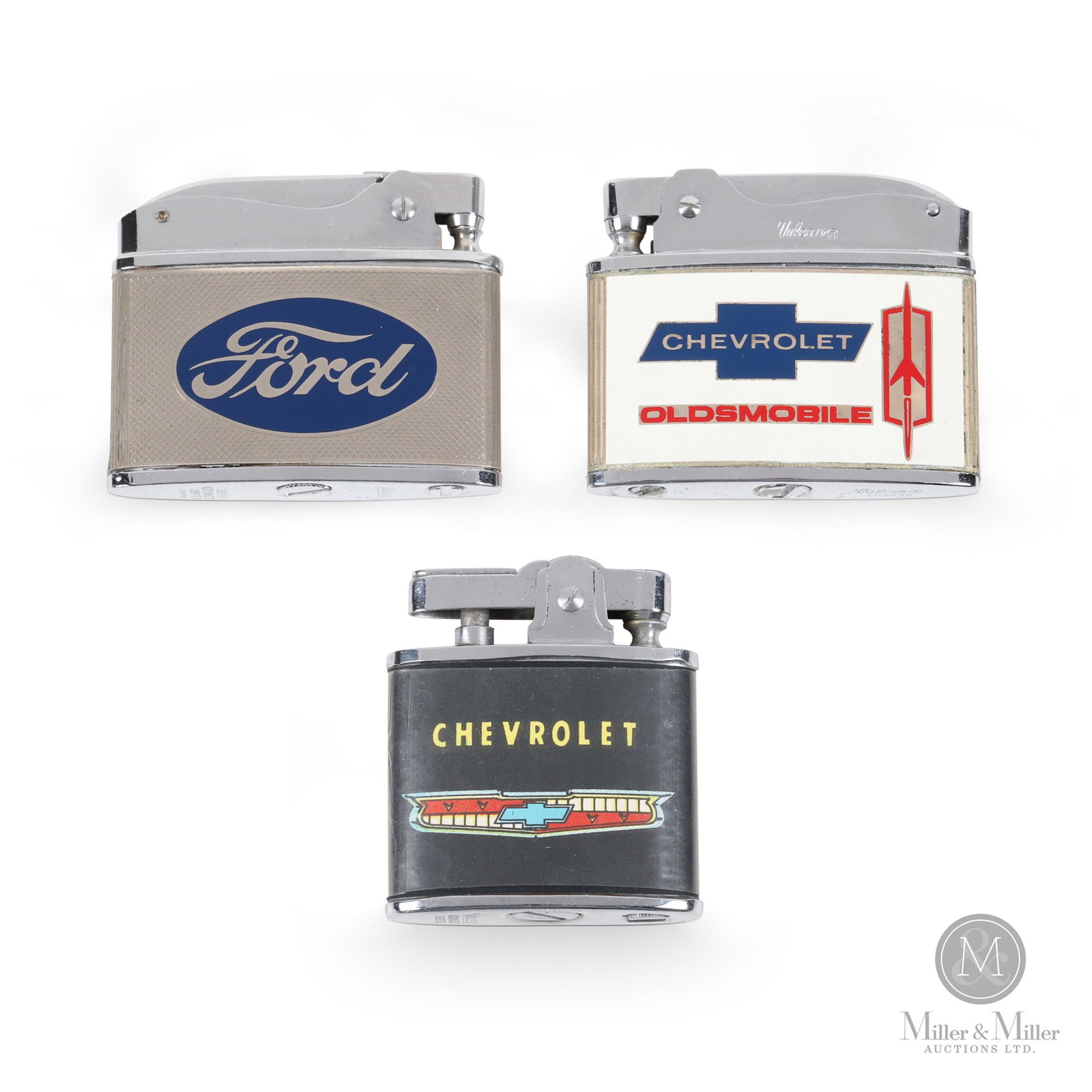 Chevrolet, Oldsmobile & Ford Pocket Lighters: American. 1950s-60s. Plated metal with applied screened celluloid and tin graphics. Stamped with makers marks on some tops and undersides. 1.75" x 2.25" x 0.25" and 2" x 1.75" x 0.25". All items are g