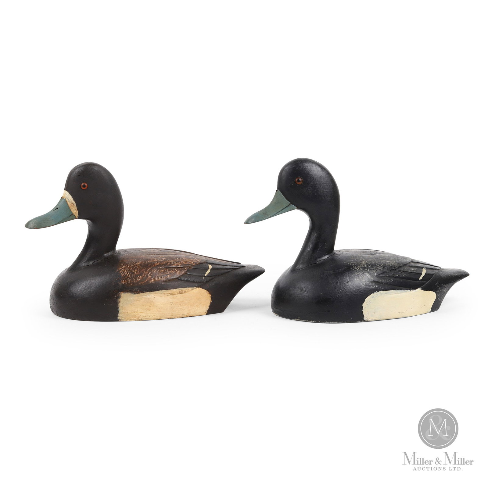 Bluebill Pair - Tor Anderson, Kingston Ontario: Kingston, Ontario. Third quarter 20th century. Painted wood. Tor Anderson (1925). Brown back: 7.5" x 13" x 6". Black back: 8" x 13.5" x 5.75".
