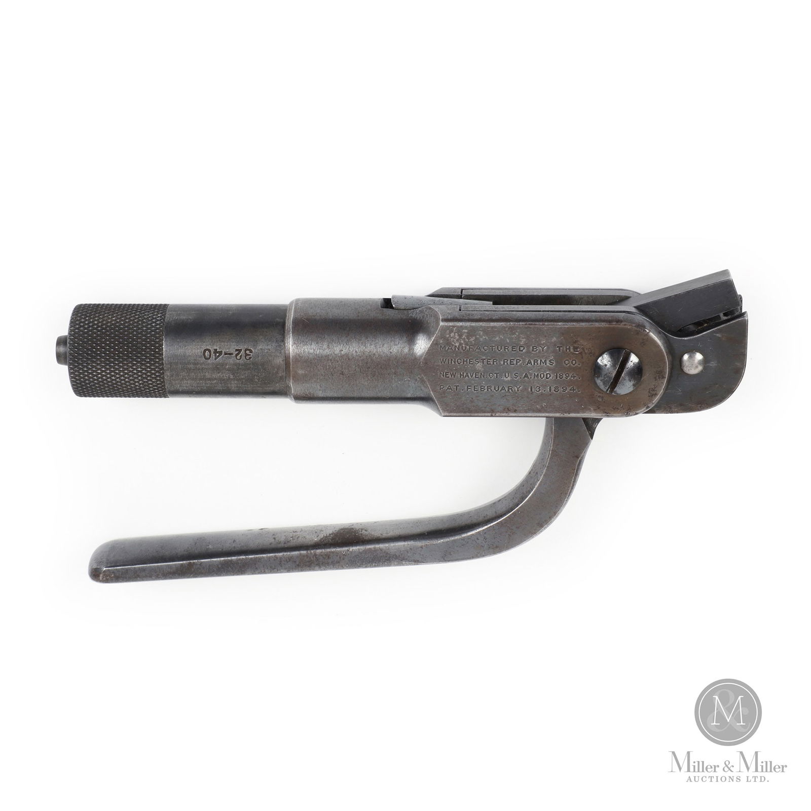 Winchester Model 1894 Stamped Ammunition Level Reloading Tool: American. For reloading 32-40 calibre rifle cartridges. calibre stamped on die section. Marked, on body of tool. 7.25" x 3.5" x 1". From the G. Wayne Connor Collection.