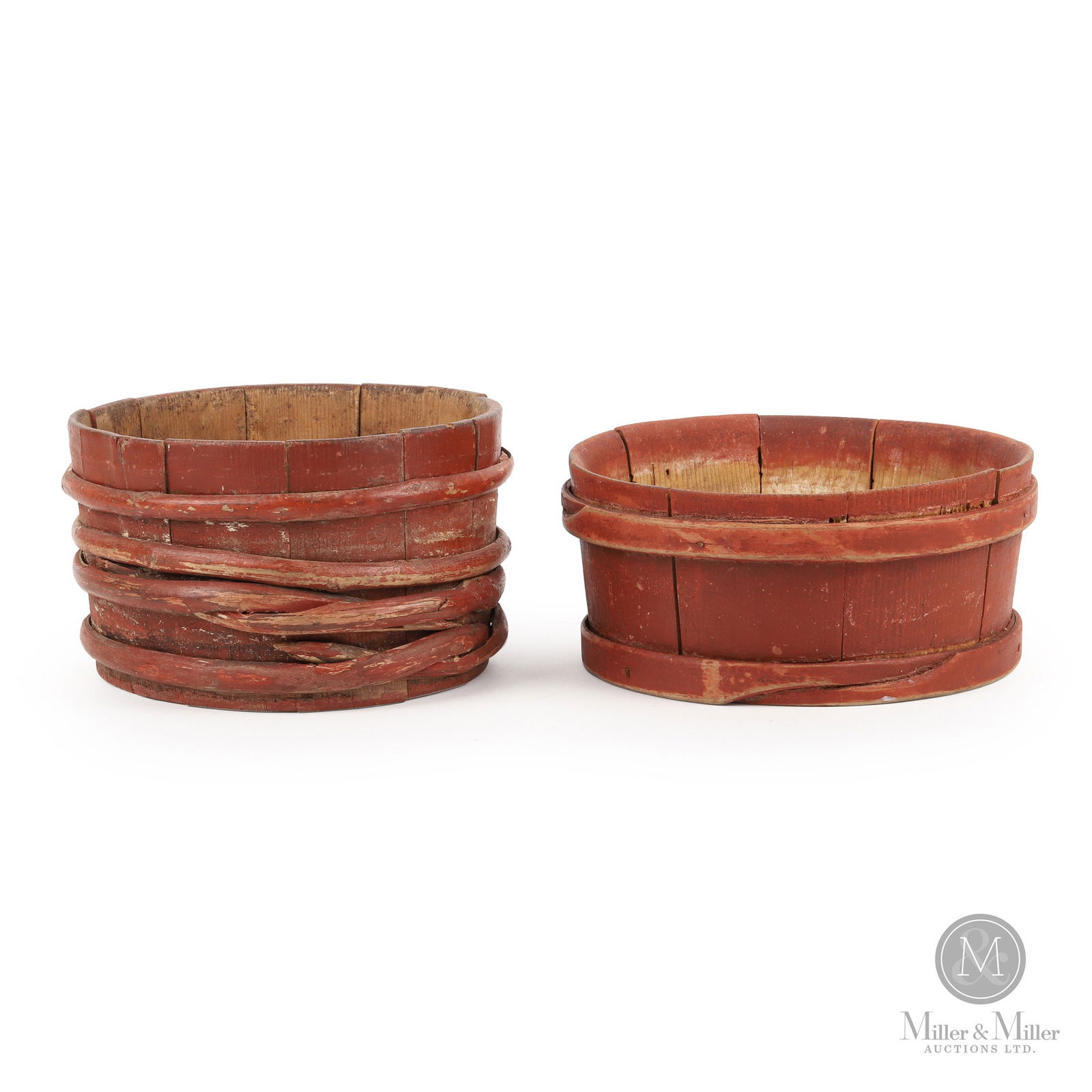 Two Keelers In Paint: A lot of two keelers or wooden tubs, both in original red paint with one having multiple crude splint bands and the other more finely crafted with pegged finger-lapped bands. Both are in good conditio