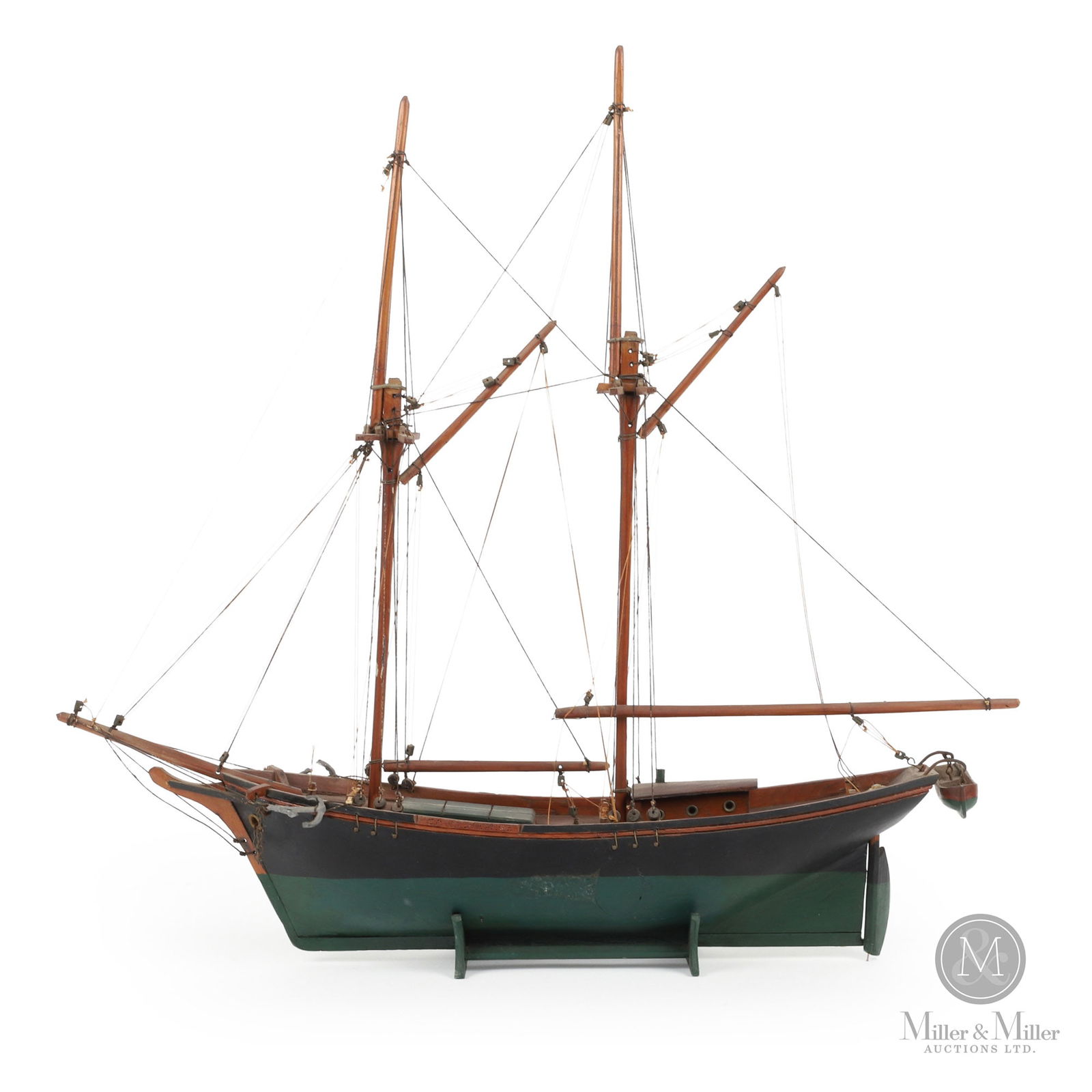 Leclerc Ship Model "Canadienne": A schooner model "La Canadienne" made by the Leclerc family of St-Jean-Port-Joli, Quebec, and signed, "A. Leclerc". Eugene Leclerc started the business in 1931 but by 1933 he was so busy the entire fa