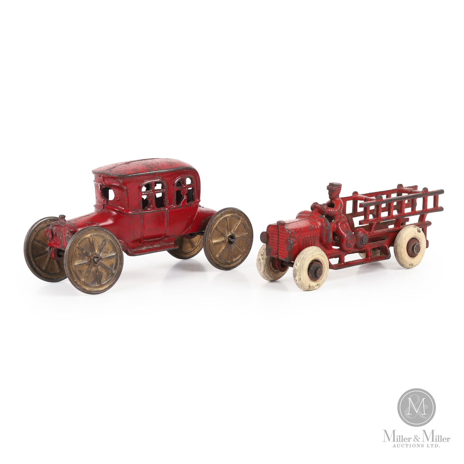 Fire Ladder Truck and Touring Carriage Car: American. Fire truck: 1920s. Touring carriage car: 1910s. The fire truck is likely made by the Kenton Hardware Co. in Kenton, Ohio. The Kenton company was founded in 1894 when it began producing mainl