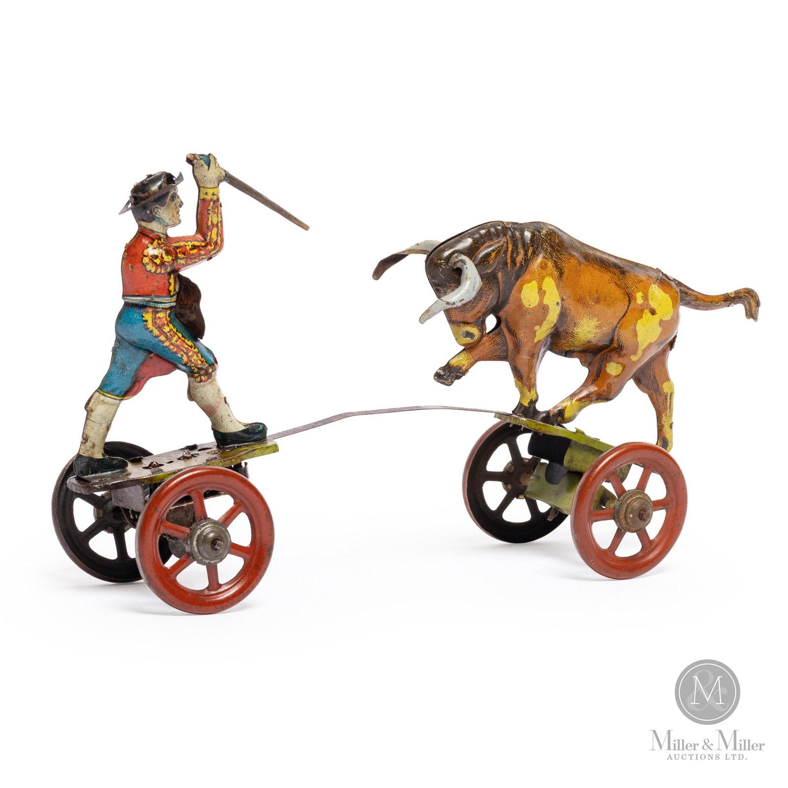 Matador With Bull Windup Toy By Einfalt: German. 1920s. Einfalt was founded in Nuremberg, Germany, in 1922 by brothers Johann and Georg Einfalt. The company was known for producing oversized "penny" toys, tin wind-ups featuring animals and h
