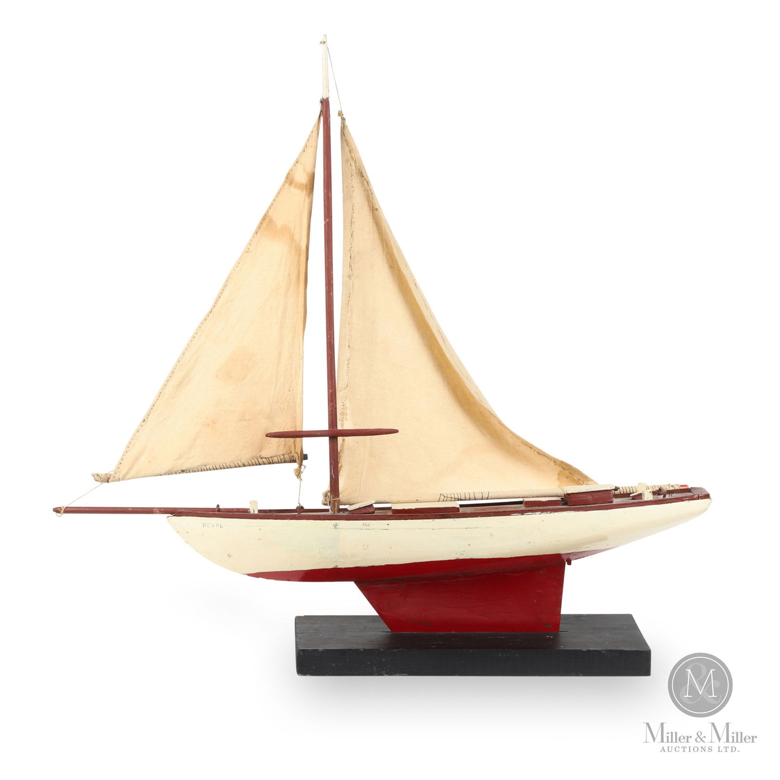 Large Pond Boat: A pond boat in old red and white paint, with original sails and a metal keel. Marked, "Pearl", on both sides of the bow and "Papeete Tahiti", on the stern. Good condition, good size, jib needs to be r