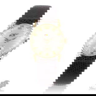 Benrus, Boxed 14K Dress Watch with Ram's Horn Lugs: Swiss. 14K yellow gold. A classic 14K gold Benrus dress watch distinguished by its sculpted ram's horn lugs, a hallmark of mid-century design flair. The watch is boxed and carries a gross assembled