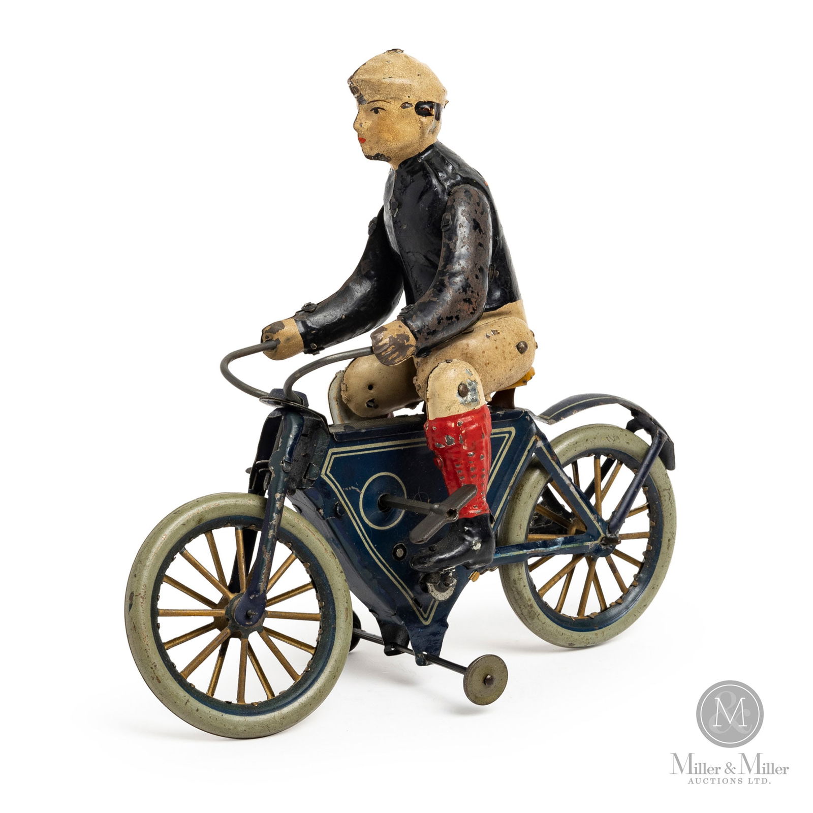 Gunthermann Windup Motorcycle: German. 1890-1910. Lithographed tin. This boy on a pedal cycle was made by the Gunthermann Company, a company considered to be one of the "elite" toy makers in the world. The company was founded in 18