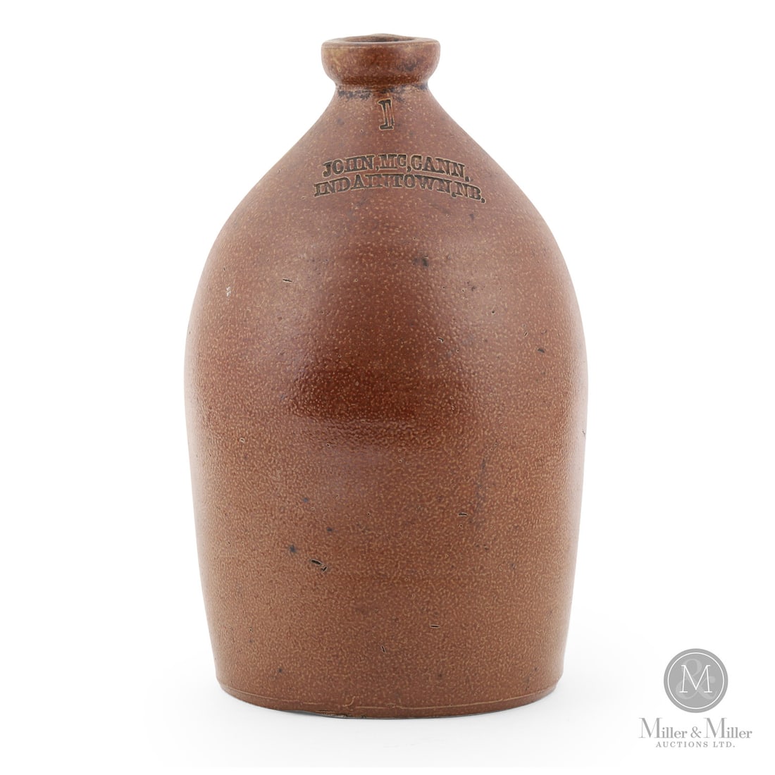 McCann, Indiantown 1 Gal Jug: Canadian. 1860-1870. John McCann 1 gal jug from Indiantown, New Brunswick. An 1860s-1870s era jug made in England for export.Size12" x 6.5" (base diameter).ConditionMint
