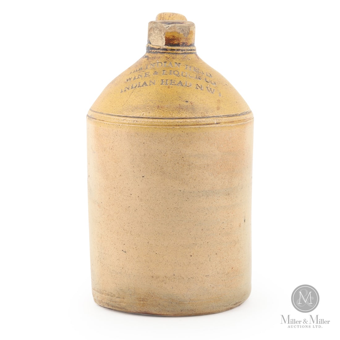 The Indian Head Wine & Liquor Co. N.W.T. 1/2 Gal Jug: Canadian. 1890-1905. The mate to the previous lot. A 1/2 gal size jug from The Indian Head Wine & Liquor Co.N.W.T. Brantford Pottery made jug. Extremely rare. Size 8.5" x 5" x 5.5". Condition Good con