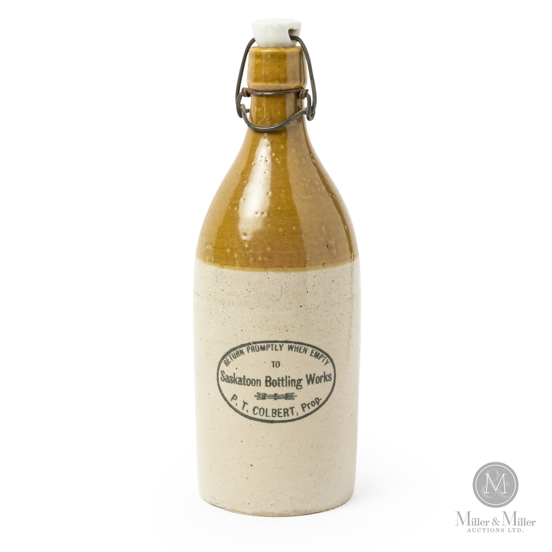 Extremely Rare Colbert Saskatoon Ginger Beer: Canadian. 1890-1910. P.T. Colbert, Saskatoon Bottling Works, quart-size ginger beer. Extremely rare Brantford Potteries variant of this bottle. Size 10.5" x 3.25" Dia. Condition Near mint with the ori
