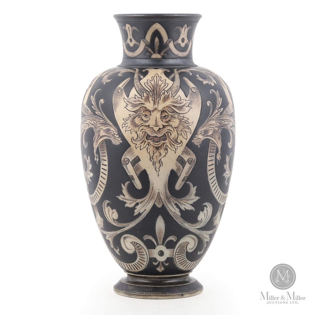 Martin Brothers Gothic Vase: British. 1896. A Martin Brothers gothic-inspired vase decorated with dragons and green men. Striking black and white patterning. Marked, "11-1896. RW Martin Bros London & Southall", on base. Size 15"