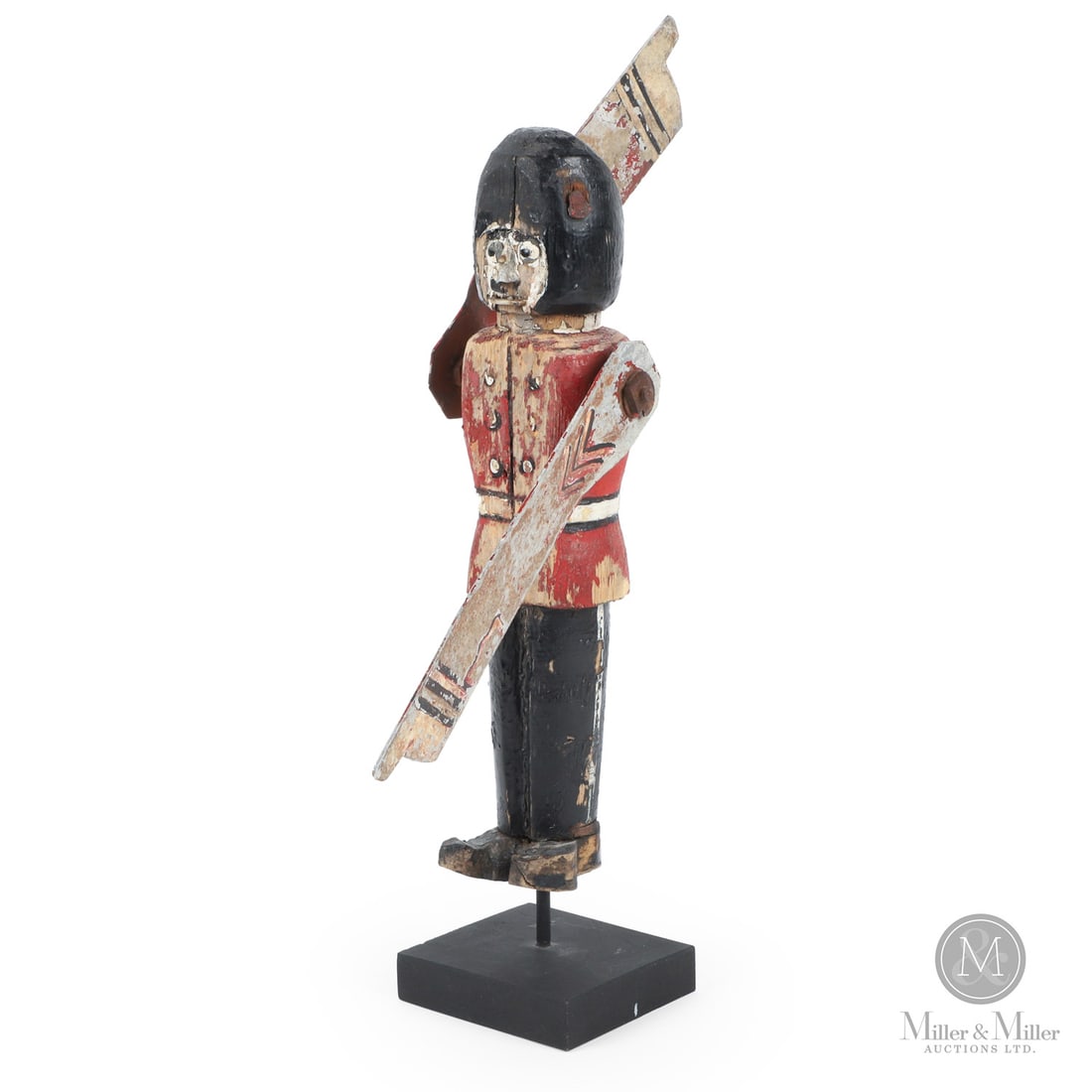 Nova Scotia Soldier Whirligig: A soldier whirligig depicting a British Foot Guard in his tall bearskin cap. Great weathered painted surface with flat metal painted blades for the arms. Innovative details include a folded metal nose