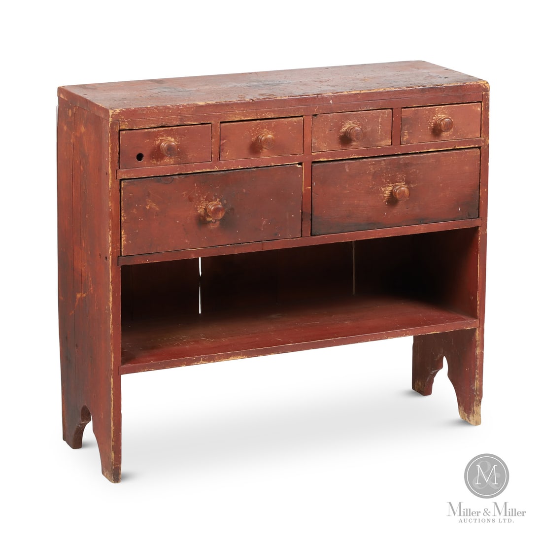 Sideboard With Pail Shelf: Canadian. Wood. A simple country sideboard/utility bench in dry red paint with six drawers over a single open pail shelf, with a decorative bootjack cutout on the sides. Good condition with