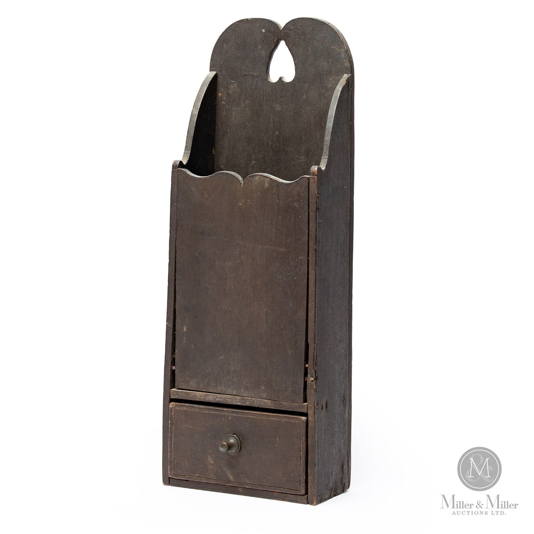 Pipe Box with Heart and Drawer: Canadian. Wood. A birch pipe box with a heart cut-out in the backboard, a scalloped edge on the back, sides, and front panel, and with a dovetailed drawer below, all in original dry brown paint. Very