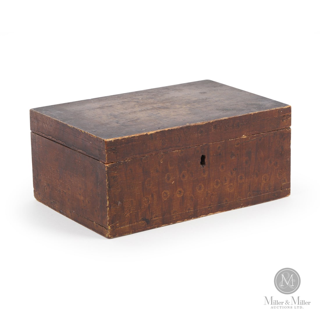 Painted Dresser Box: Canadian. Wood. A small pine dovetailed deed box with a vinegar-sponged faux birdseye surface. Original brass hinges and lock. Ontario, 19th century. 4" x 9" x 6". From the late Howard Pain Collection