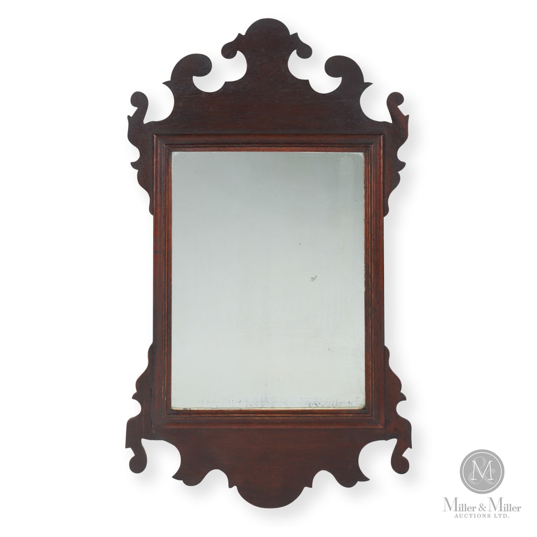 Chippendale Mirror: Canadian. Wood. A Chippendale mirror from the Niagara Peninsula with a scrolled fretwork frame and a hand-planed pine backboard. Very good condition in original stain and varnish; one ear professional
