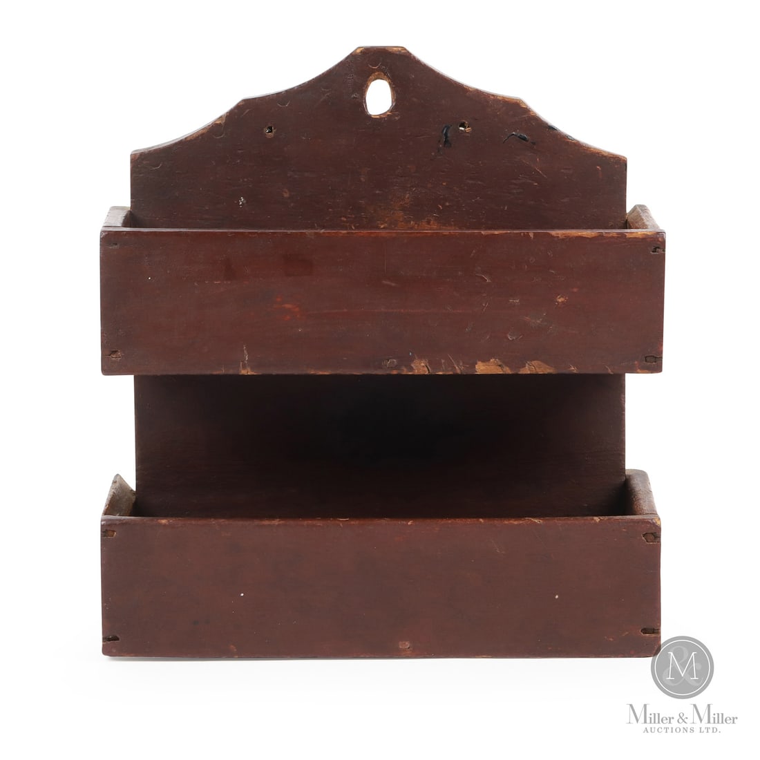 Two-Tier Wallbox in Oxblood Paint: Canadian. Wood. A two-tier wall box from Elgin County with a shaped backboard and in original red paint. Very good condition, square nail construction, minor old chip on the inside left edge of the lo