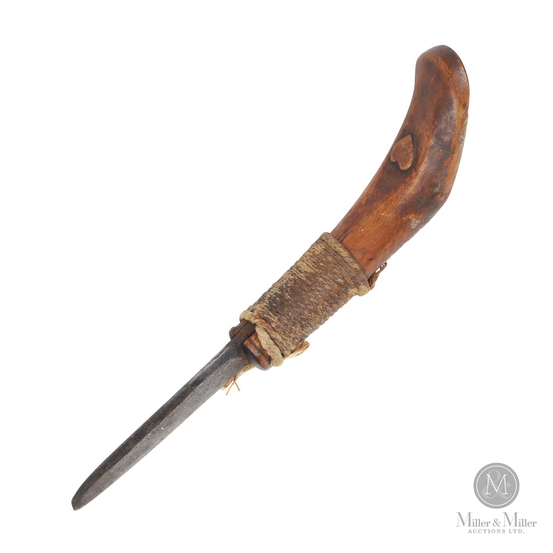 Hebb Family Lunenburg Crooked Knife: Canadian. Wood, metal. A simple crooked knife with a relief carved heart on the handle and incised, "Ammon Hebb", on the underside. The Hebb family first came to Nova Scotia from Germany in 1751 and