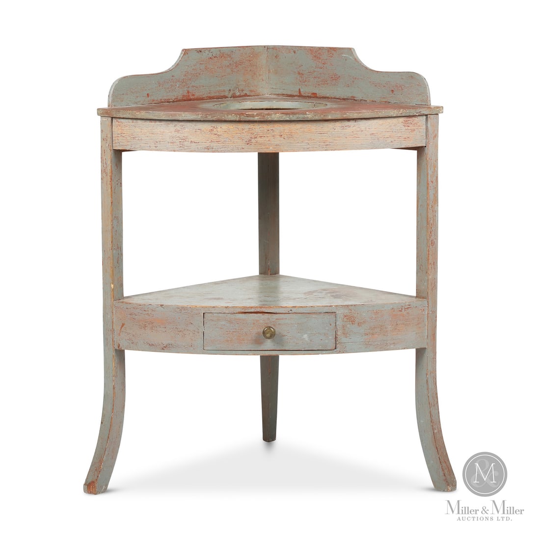 Pine Corner Washstand In Paint: Canadian. Wood. A large pine corner washstand with a shaped and dovetailed gallery on the top and curved "French" feet, and having a dovetailed drawer in the lower shelf with the original brass knob.