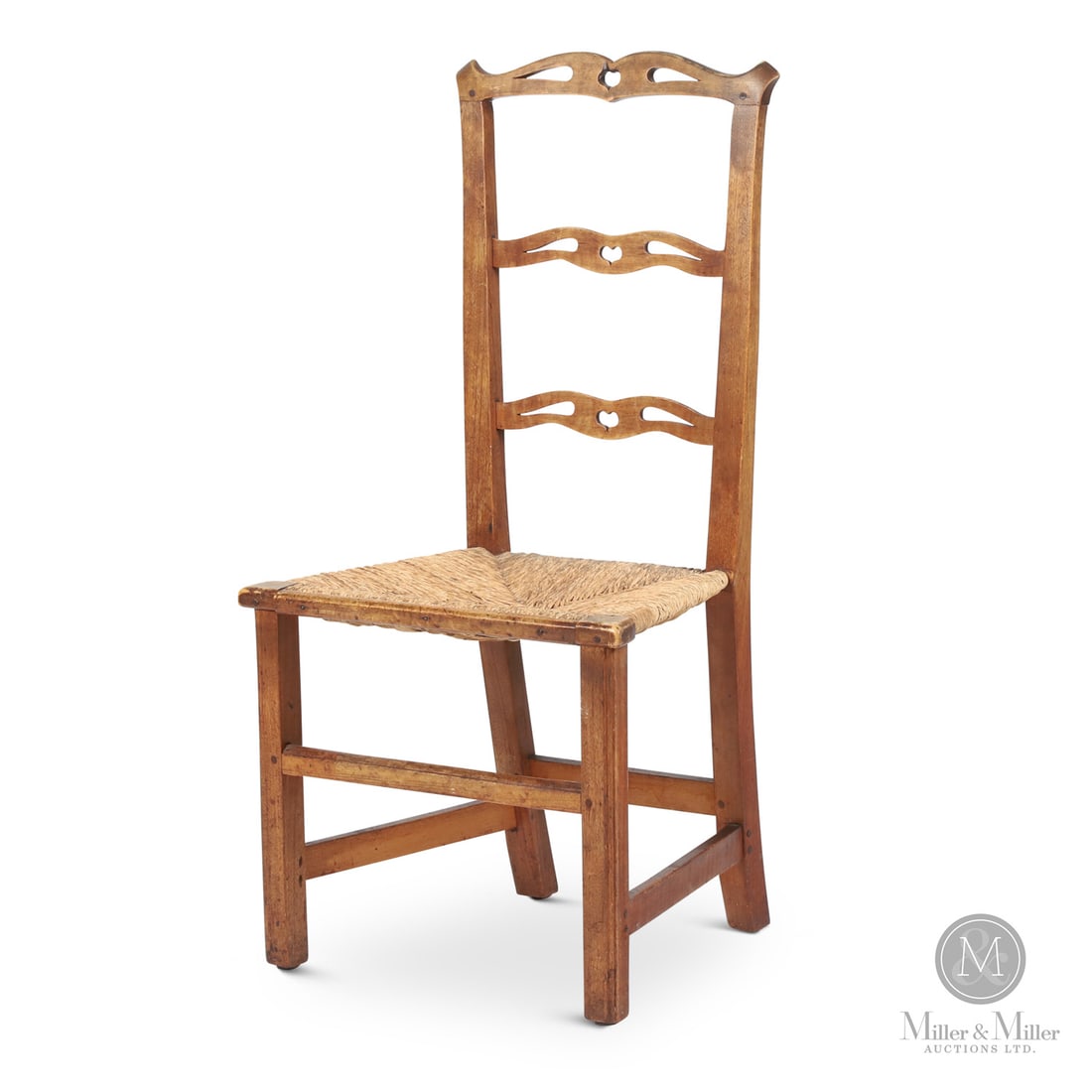 Nova Scotia Chippendale Chair with Hearts: Canadian. Wood. A country Chippendale ladder back side chair with the pierced back slats having a heart at the centre. In birch with flared "ears" on the back posts and having square legs with a molde