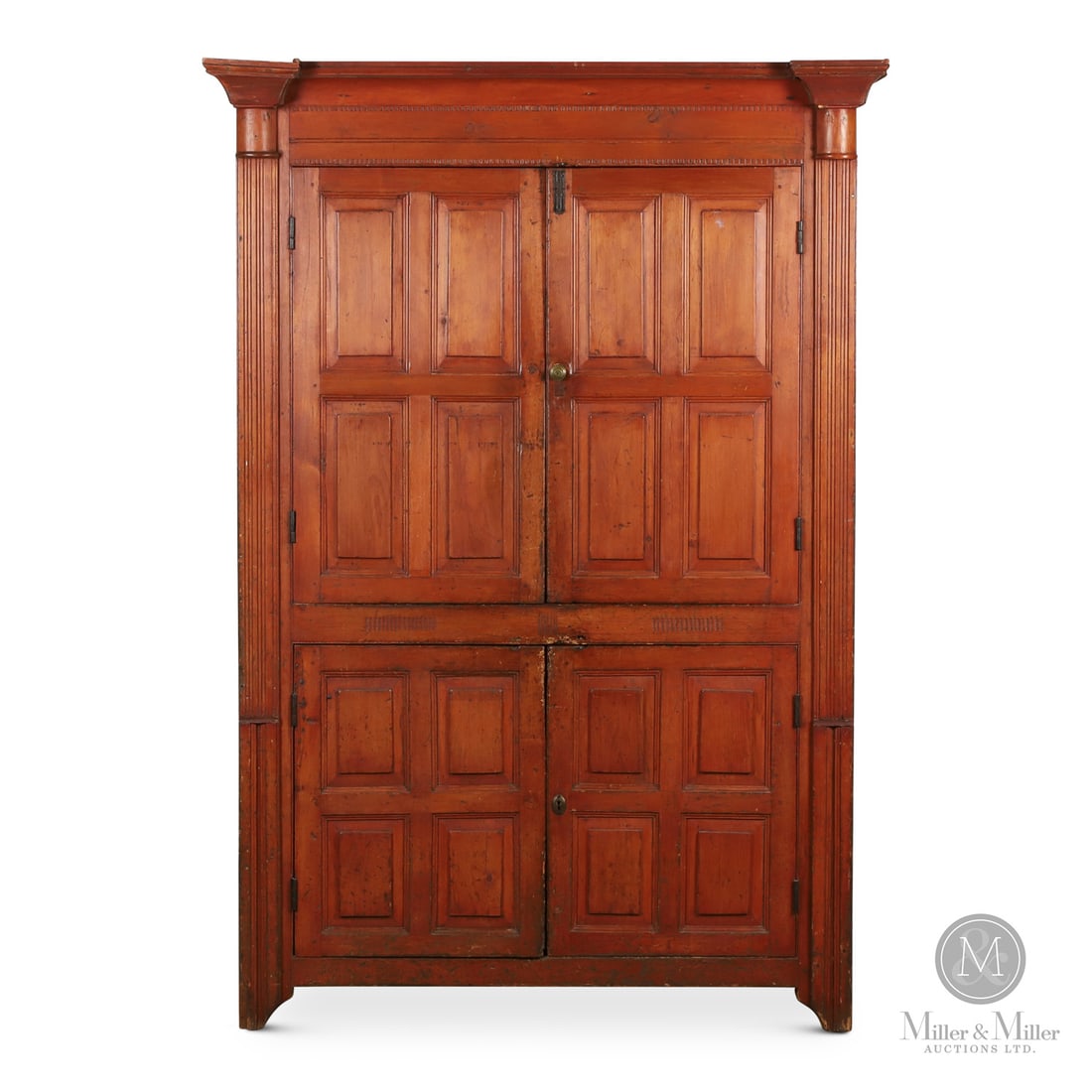 Frontenac County Cupboard: Canadian. Wood. A Neoclassic pine cupboard from Frontenac County with four raised panel doors flanked by architectural columns and having bootjack cutouts on the sides. The classic cornice has chisel-