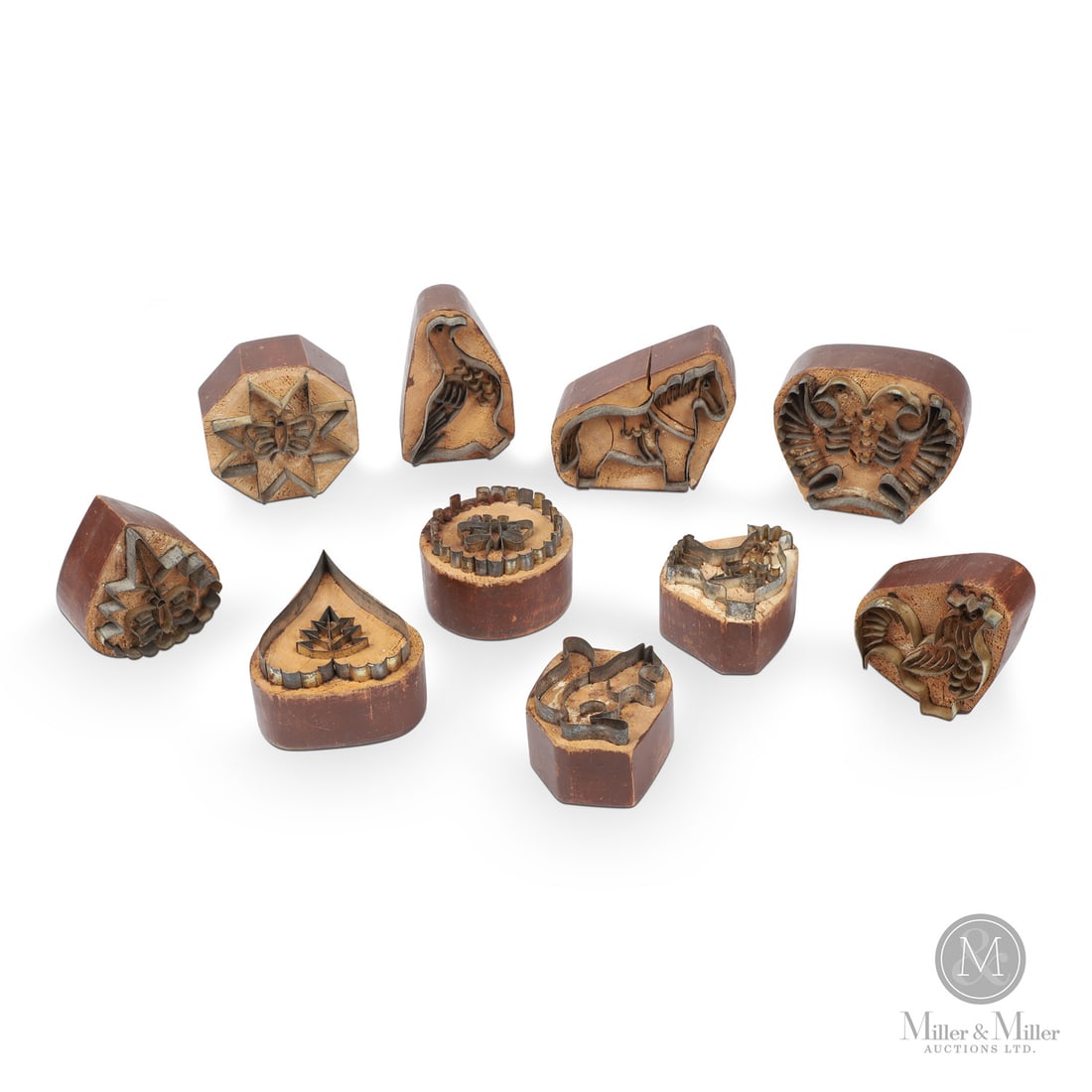 Saskatchewan Cookie Cutter Collection: Canadian. Tin, wood. A rare collection of Mennonite cookie cutters with the finely detailed tin motifs inset into original painted pine blocks. Illustrated in "Folk Furniture of Canada's Doukhobors,