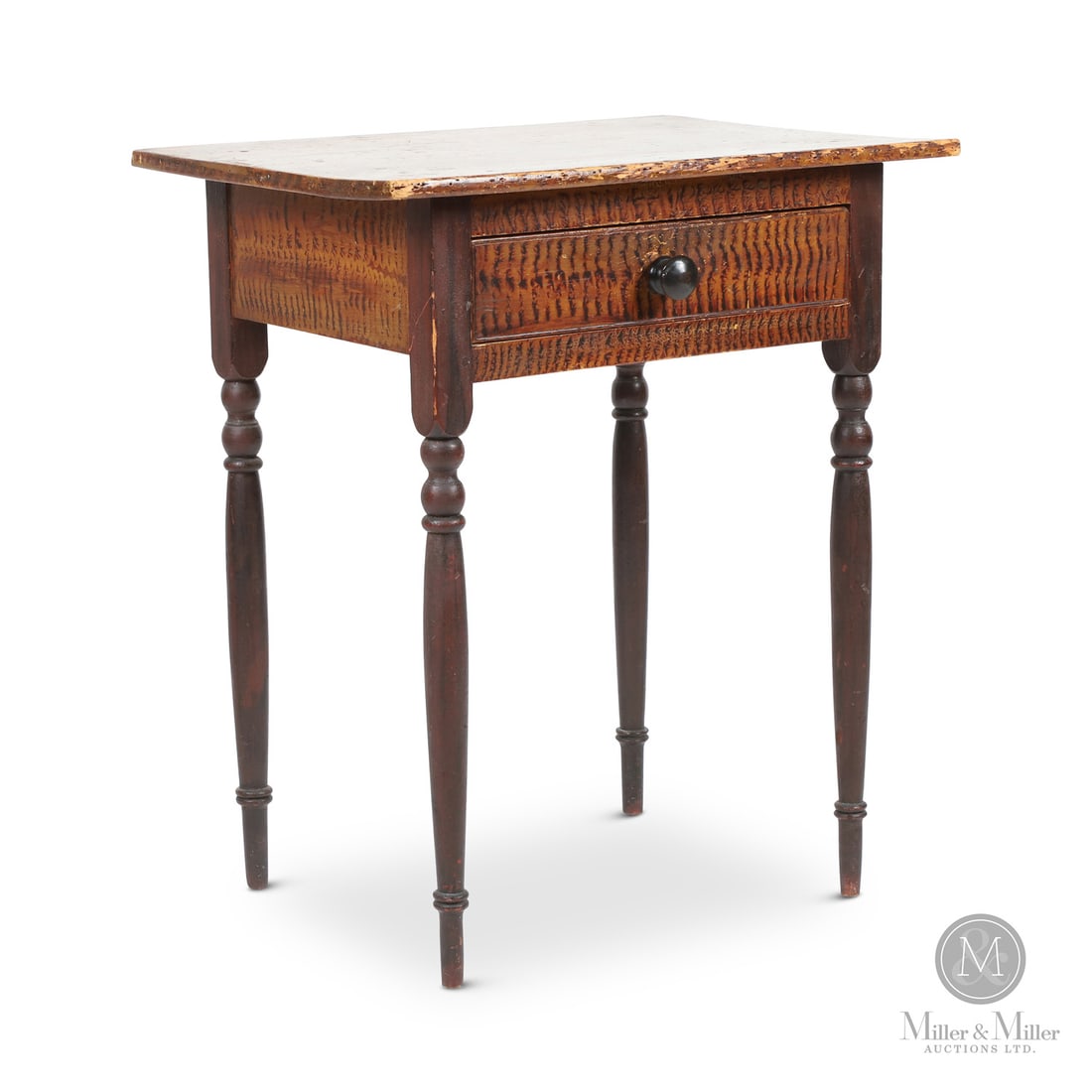 Lamp Table with Exceptional Paint: Canadian. Wood. A Nova Scotia lamp table with superb faux-grain paint simulating figured maple on the top, skirt, and drawer front and with the legs in a faux rosewood graining. The top also has a fan