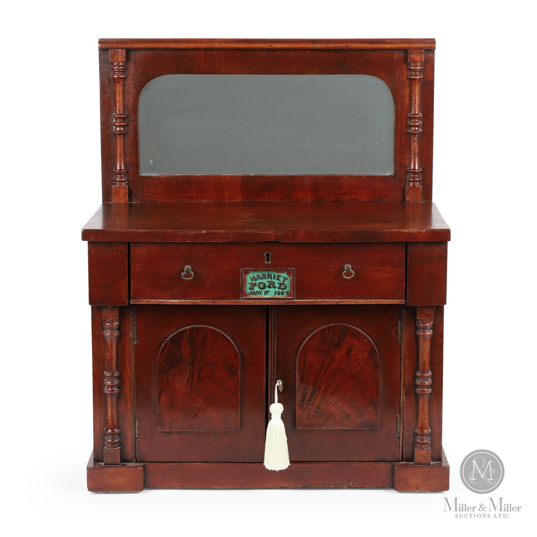 "Harriet Ford" Mahogany Sideboard: Canadian. Wood, glass. A child's mahogany buffet with a mirrored backboard over a single drawer and two doors below. The protruding drawer is adorned with a centred glass panel reverse-painted