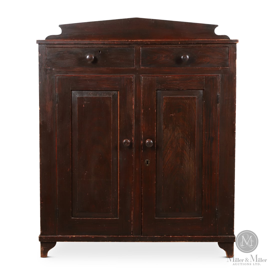 Waterloo County Pine Sideboard: Canadian. Wood. A pine sideboard with two raised panel doors, two drawers, a shaped base and a shaped backboard. In very good original red and black paint, crotch grained on the door panels to