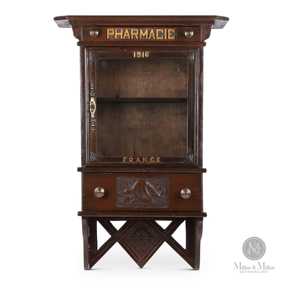 Quebec Medicine Chest with Beaver: Canadian. Wood. A Quebec medicine chest marked, "1916 France", on the door and having two drawers, the main drawer with a beaver carved on the front and a smaller top drawer marked, "Pharmacie".