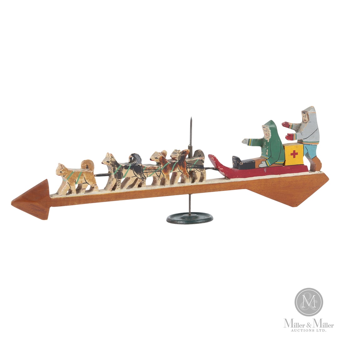 Grenfell Dog Sled Wind Directional: Canadian. Wood. A wind directional made by the Grenfell Mission in Newfoundland/Labrador, showing a dog sled delivering medical supplies. Original paint with the sled and dogs atop a red painted