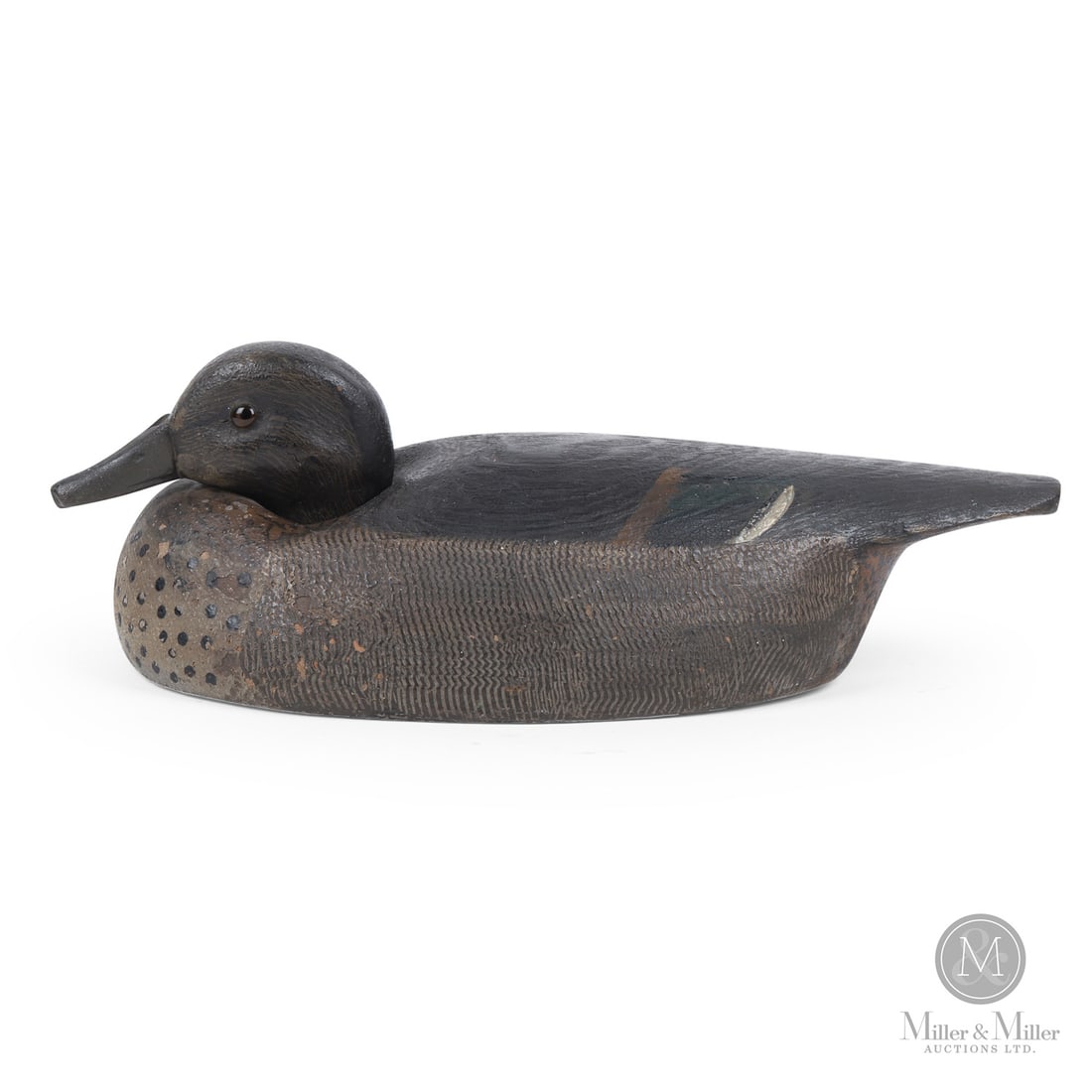Billy Ellis (1866-1963), Whitby, Ontario, Low-head Greenwing Teal Decoy: Whitby, Ontario. Second Quarter 20th Century. Painted wood. 3.75" x 11.75" x 5.5". From the Art and late Shirley Philp Collection. Whitby, Ontario. Second Quarter 20th Century.