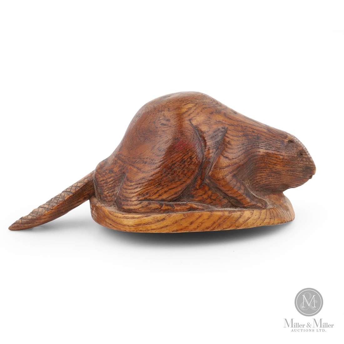 Beaver Canoe Cup: Canadian. Wood. A robust canoe cup with a full-bodied beaver hollowed out for the cup and the tail acting as the handle. Finely carved in ash and in very good condition with warm patina. Maritimes,
