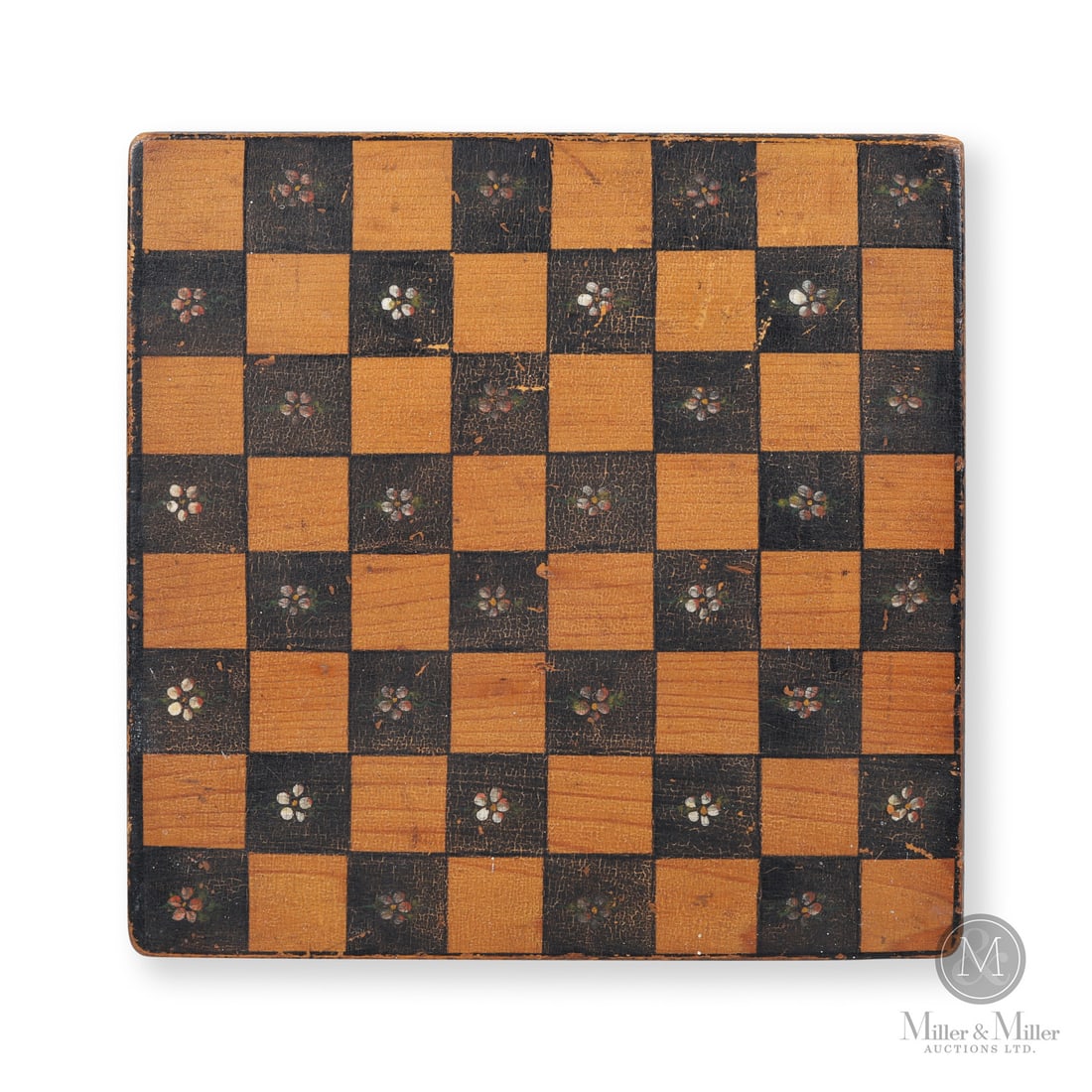 Checkerboard with Flowers: Canadian. Wood. A small checkers/chess board with a wonderful, crazed surface in black with alternating natural colour squares. Each black square has a painted five-petal white flower at the centre.
