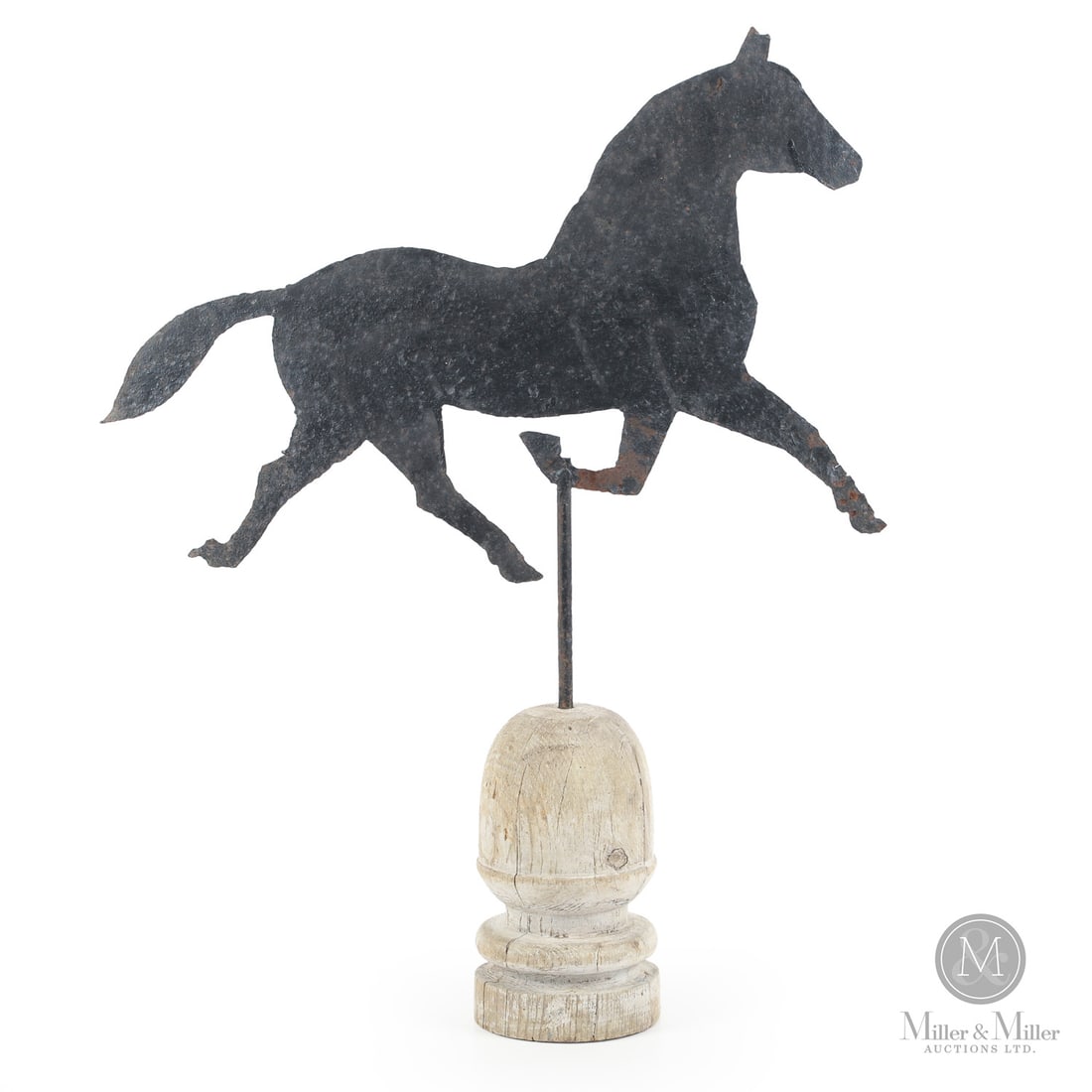 Trotting Horse Weathervane: Canadian. Metal. A sheet iron trotting horse weathervane in a weathered surface. Very good condition and mounted on an early wooden acorn finial. Nova Scotia, early 20th century. On finial: 26" x
