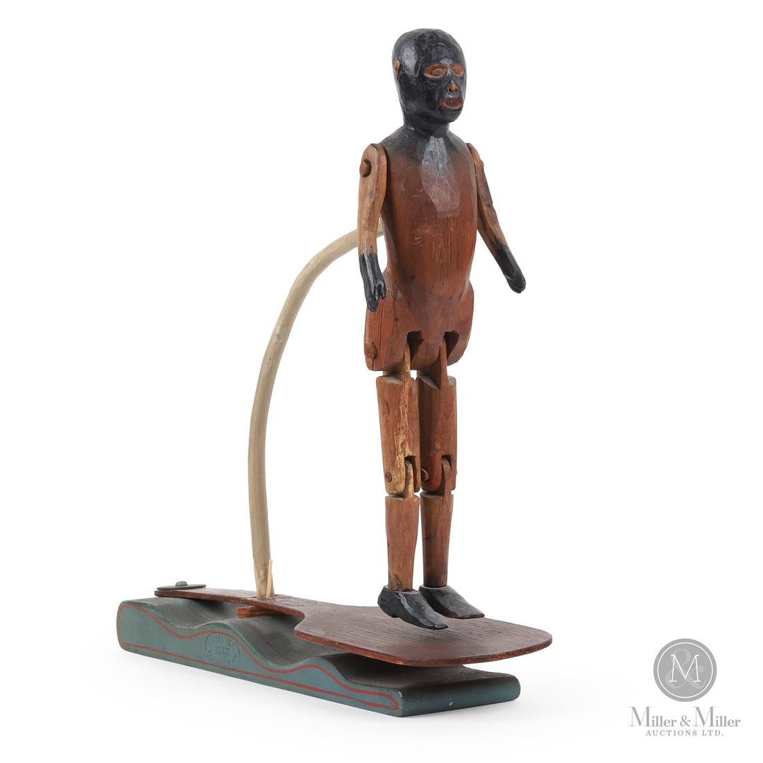 Dancing 1863 Wooden Toy: American. Wood. A jointed and articulated dancing figure in original paint and surface with the original base and treadle/paddle. Great patina, very good condition with the base in original blue