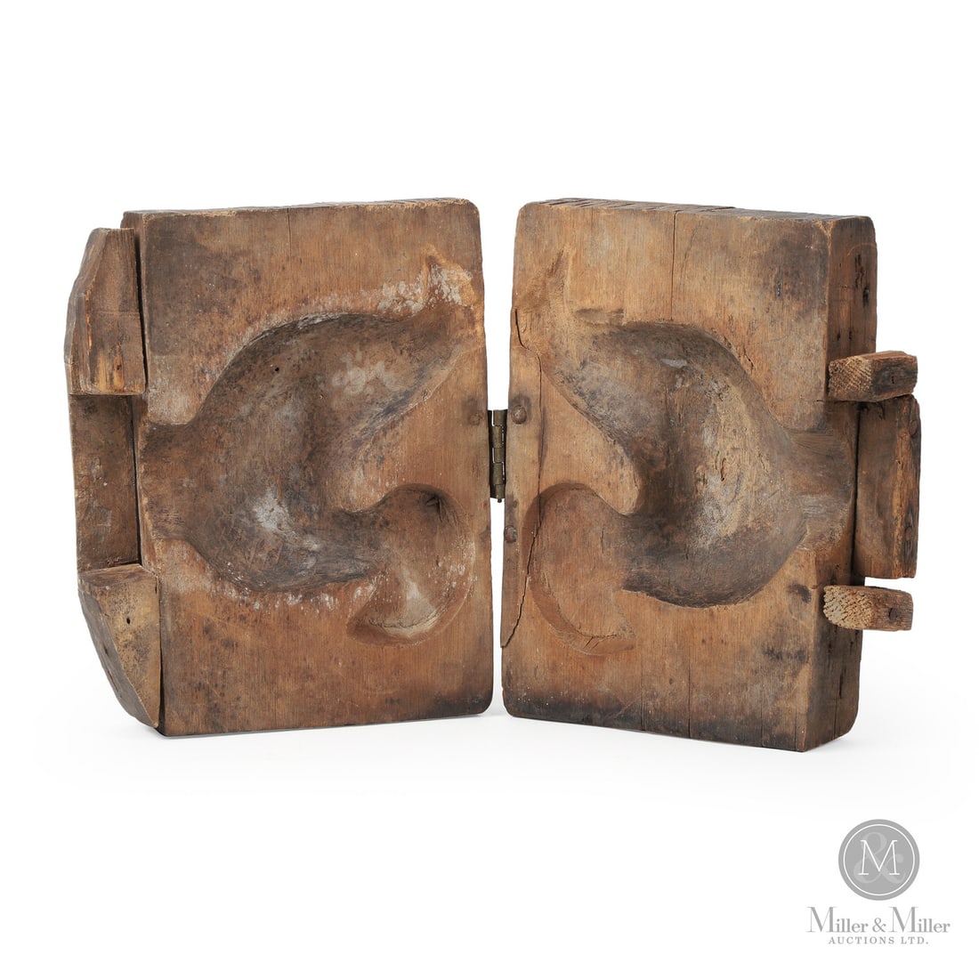 Early Rooster Sugar Mold: Canadian. Wood. A two-part maple sugar mold with a deeply carved rooster. The two sides are hinged (original). Very good condition, nice patina, and old repair to crack on one side near the hinge. Ex