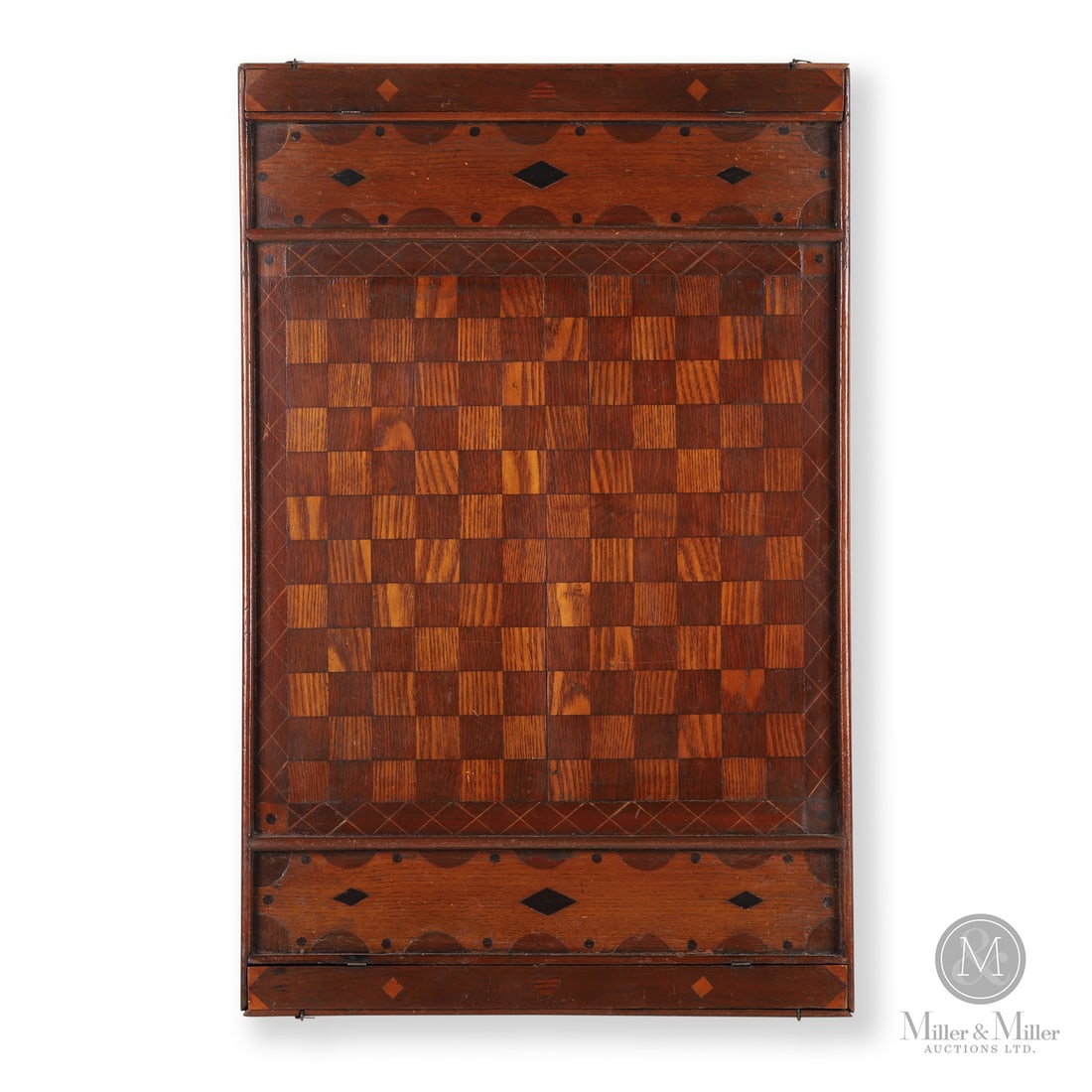 Inlaid "Joseph Trudeau" Gameboard: Canadian. Wood. A Quebec gameboard (12x12 squares) inlaid with "Joseph Trudeau" and with the keeper sections having a hinged box for storage of the playing pieces. Inlaid diamonds and demi-lune
